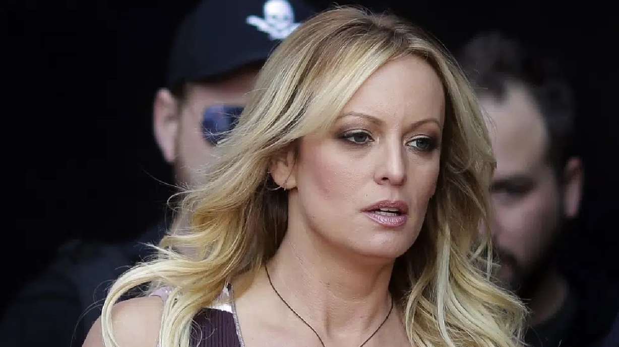 Stormy Daniels arrives for the opening of the adult entertainment fair Venus in Berlin, on Oct. 11, 2018. Daniels' lawyer said she met Wednesday with prosecutors who are investigating hush money paid to her on behalf of former President Donald Trump.
