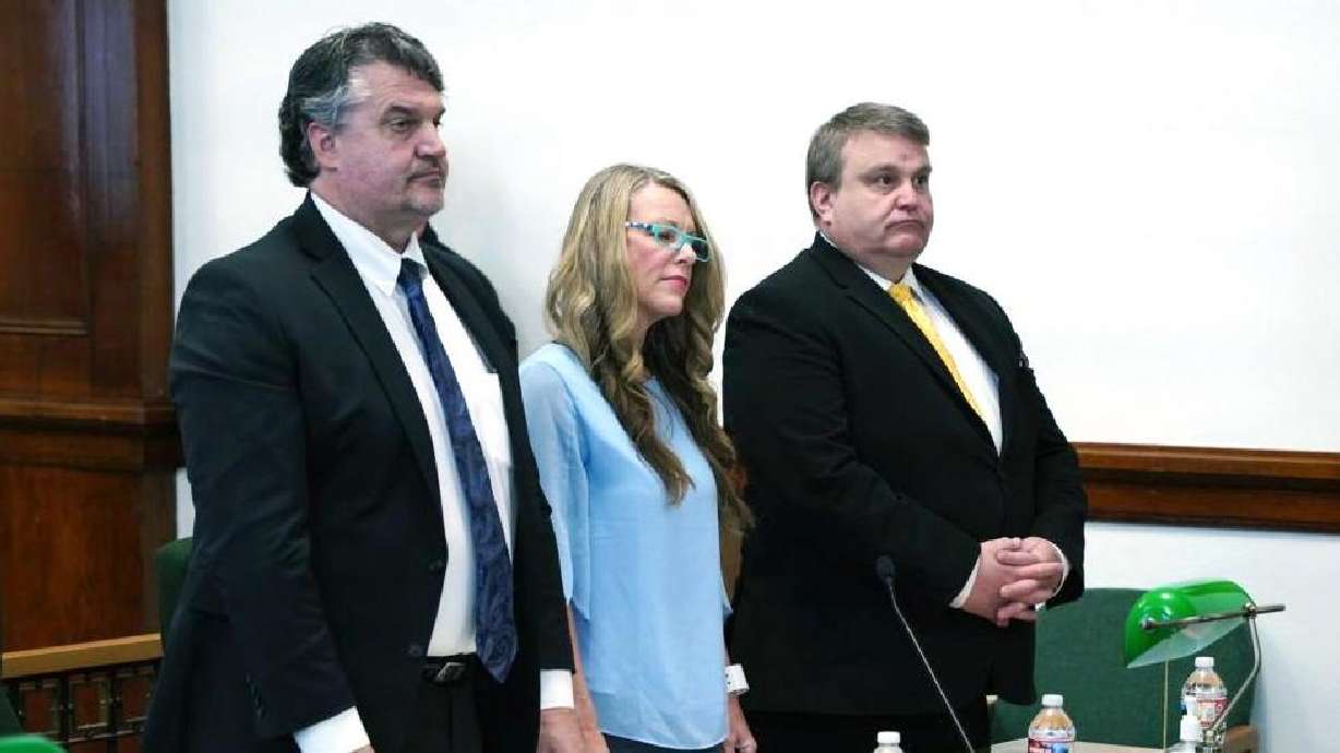 Lori Vallow Daybell stands between defense attorneys Jim Archibald and John Thomas on April 19, 2022. A judge will issue a decision next week on three motions in the Lori Vallow Daybell case.