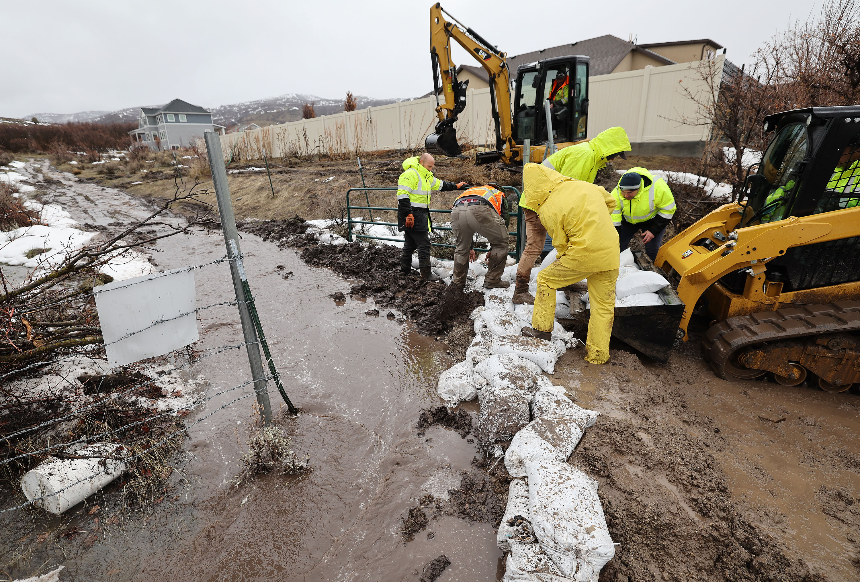 City employees fill sand bags due to flooding in Highland on March 15.