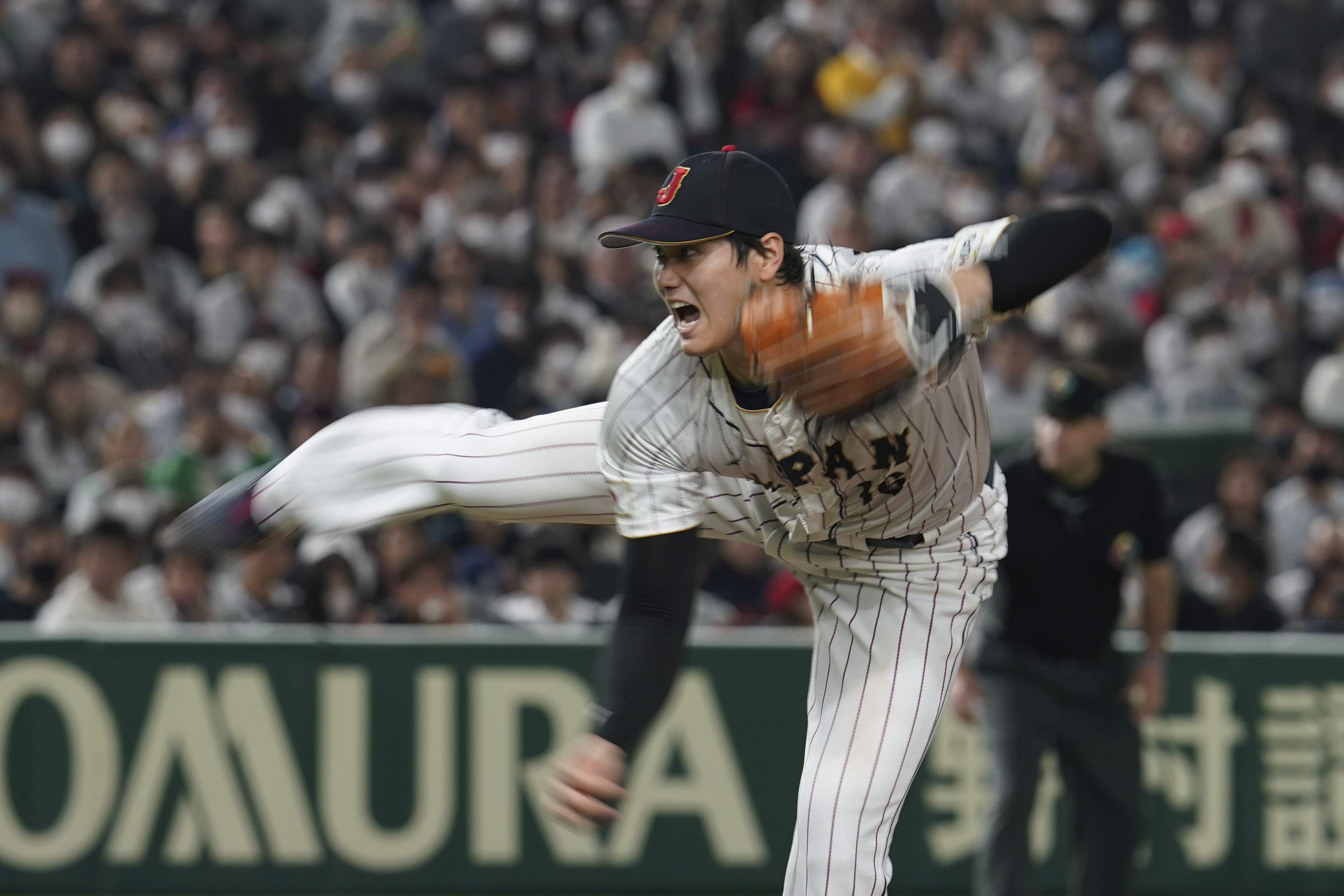 Shohei Ohtani of Japan throws during the fifth inning of the quarterfinal game between Italy and Japan at the World Baseball Classic (WBC) at Tokyo Dome in Tokyo, Japan, Thursday, March 16, 2023. 