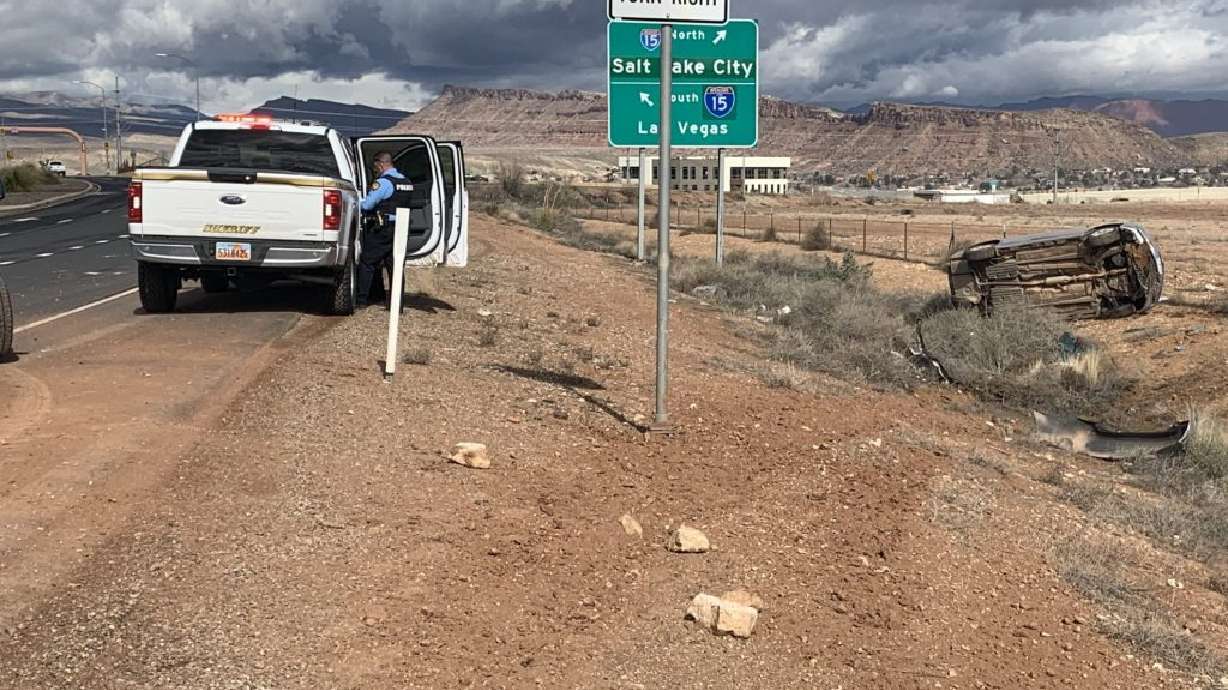 Toyota Camry following rollover on state Route 7 in St. George, Saturday. The crash led to the arrest of a man who was found to be a suspect in a previous case involving a van that was stolen from the parking lot of the jail in Washington County.