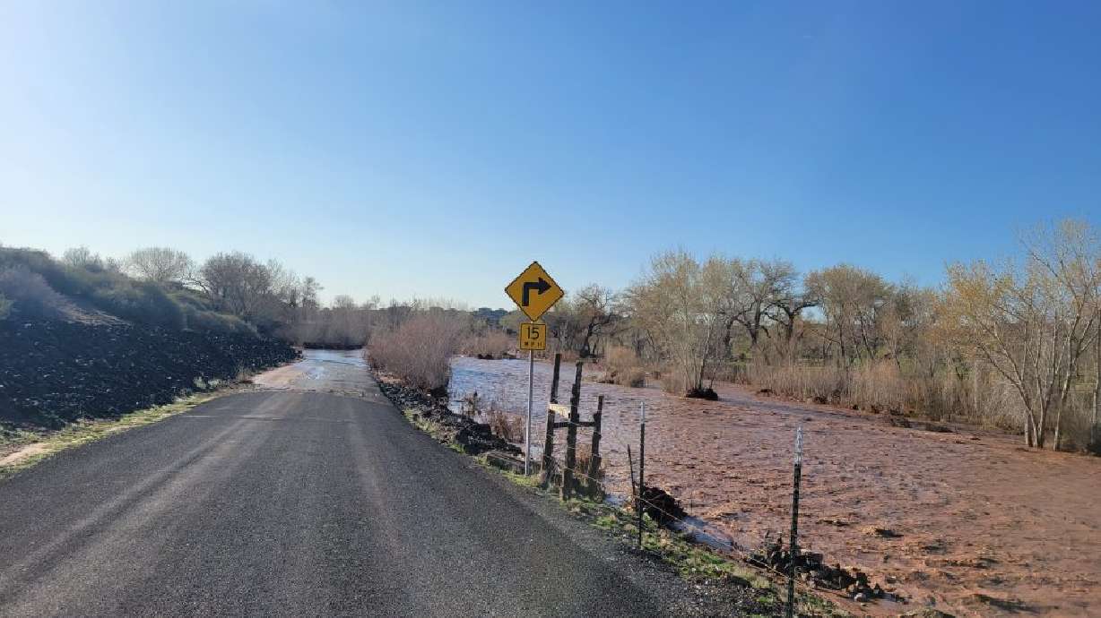 Even as the Santa Clara River was receding, flood waters still covered Lava Flow Drive near the Sunbrook Golf Club, St. George, Thursday.