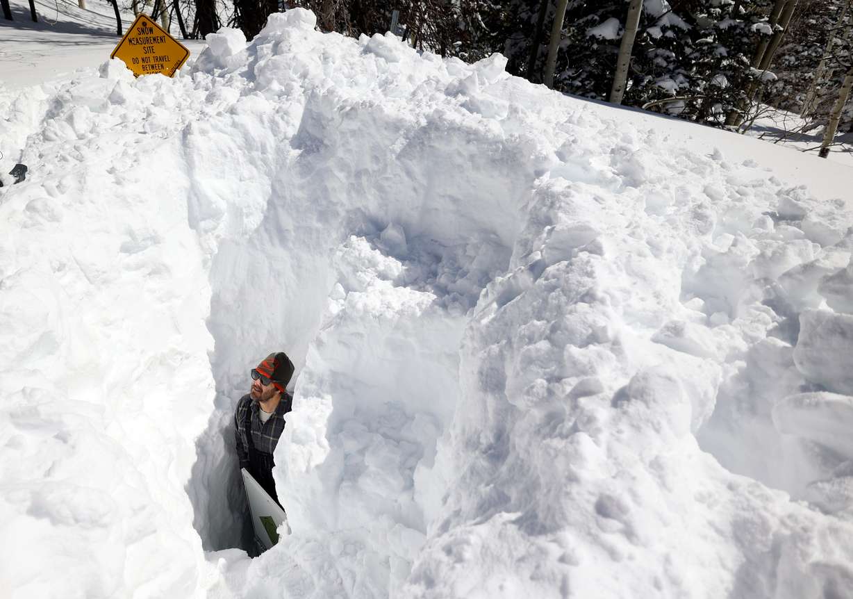Dave Eiriksson, Natural Resources Conservation Service snow survey hydrologist, stands in a snow pit that was dug to access buried electrical components at the Atwater SNOwpack TELemetry (SNOTEL) site, operated by the USDA’s NRCS, in Alta, on March 16. Utah's statewide snowpack reached 30 inches for the first time on record during the 2023 water year.