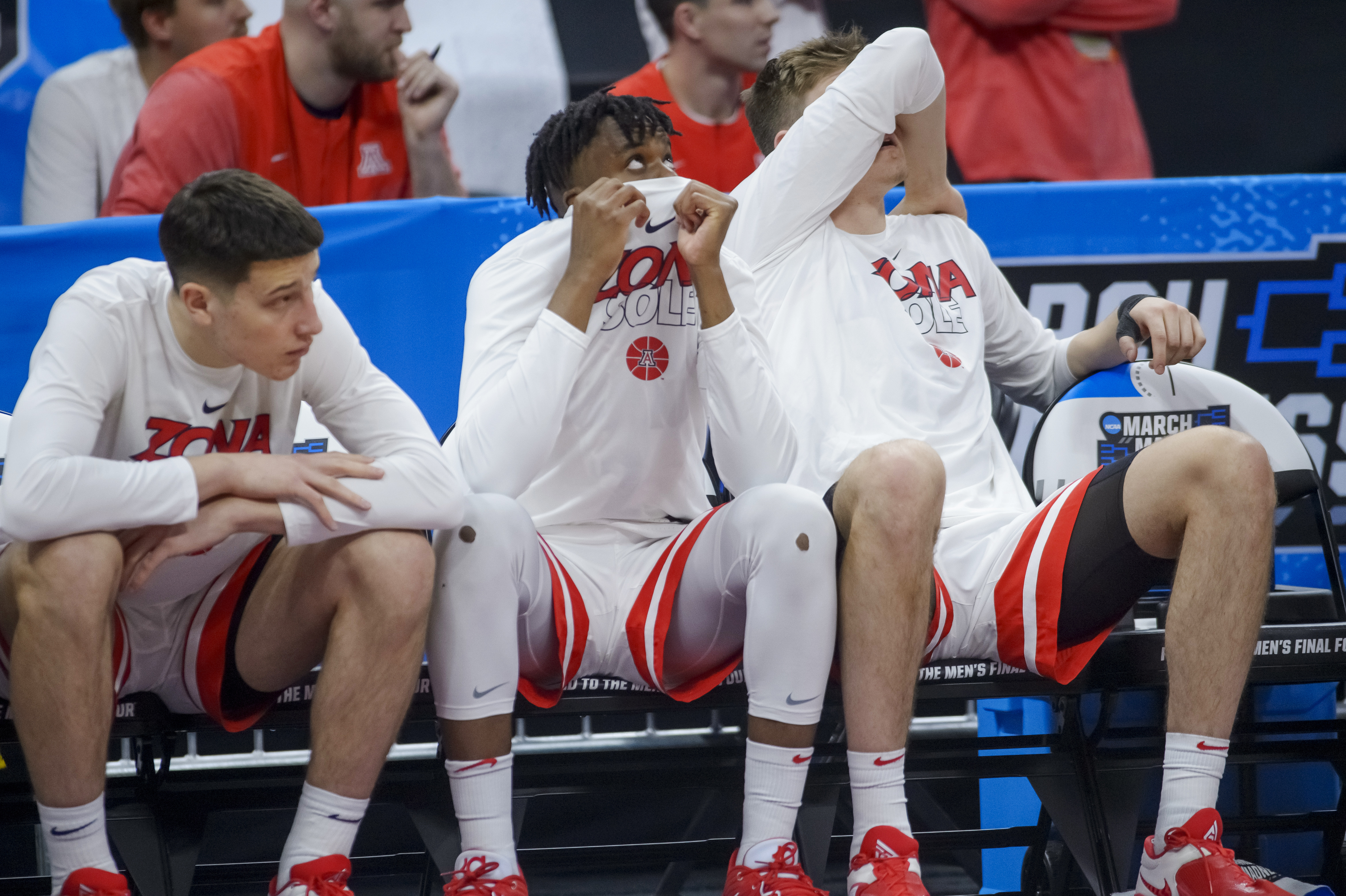 Arizona players sit on the bench in the final seconds of a first-round college basketball game against Princeton in the men's NCAA Tournament in Sacramento, Calif., Thursday, March 16, 2023. Princeton won 59-55.