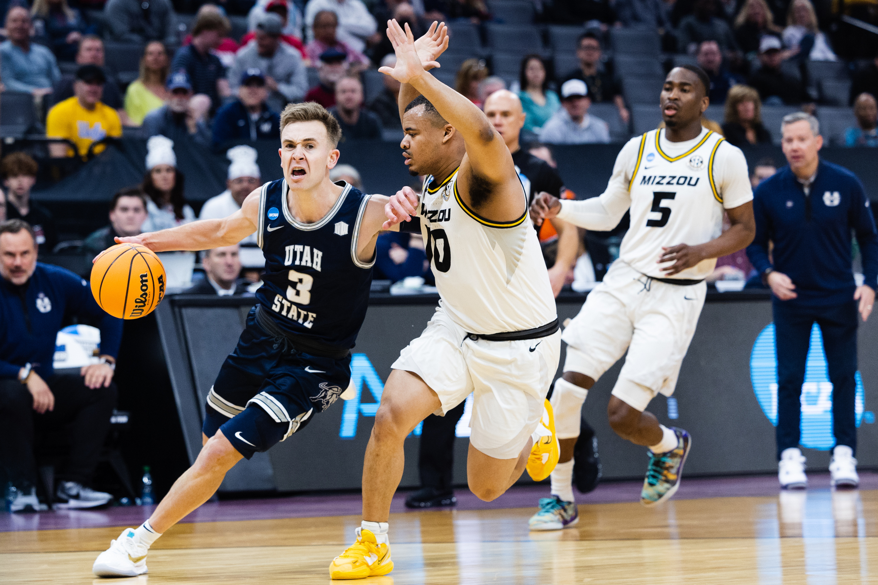 Utah State Aggies guard Steven Ashworth (3) drives to the basket during the first round of the NCAA men’s basketball tournament between Utah State and Missouri at the Golden 1 Center in Sacramento on March 16, 2023.