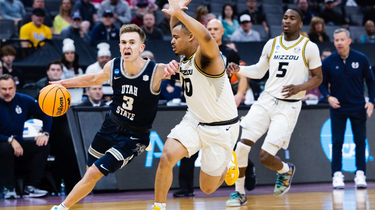 Utah State Aggies guard Steven Ashworth (3) drives to the basket during the first round of the NCAA men’s basketball tournament between Utah State and Missouri at the Golden 1 Center in Sacramento on March 16, 2023.