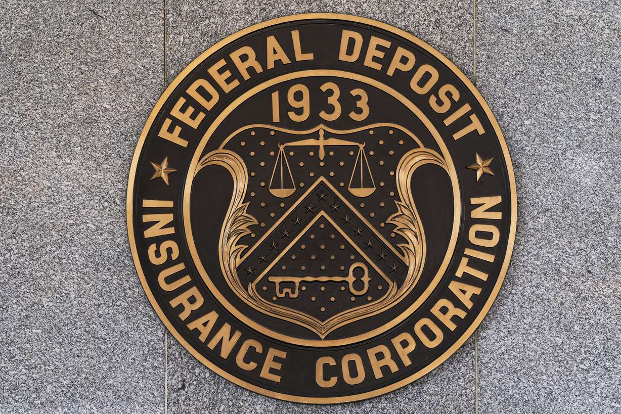 The Federal Deposit Insurance Corporation seal is shown outside its headquarters, Tuesday.