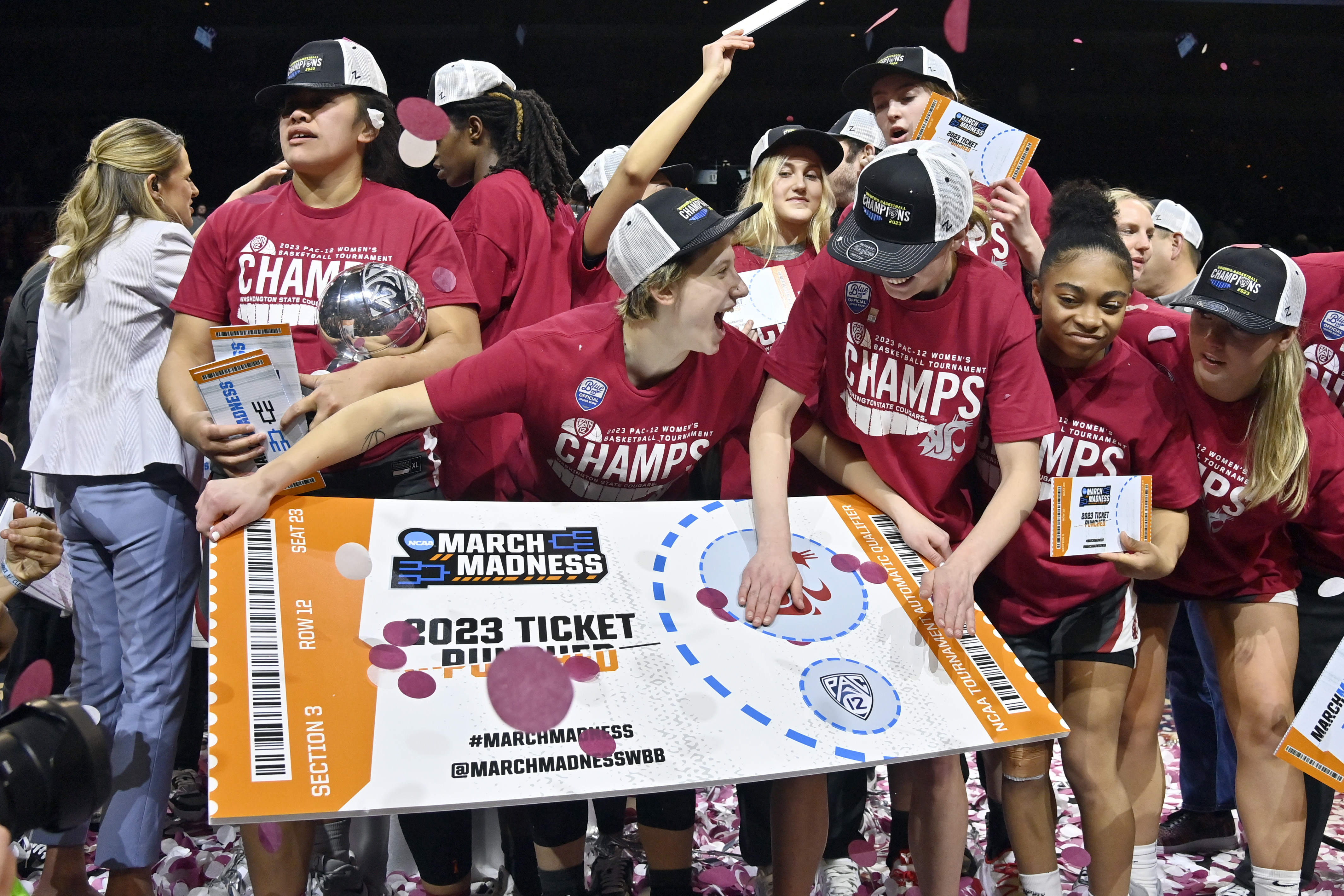 Washington State celebrates by "punching their ticket" after the team defeated UCLA in an NCAA college basketball game in the finals of the Pac-12 women's tournament, Sunday, March 5, 2023, in Las Vegas. 