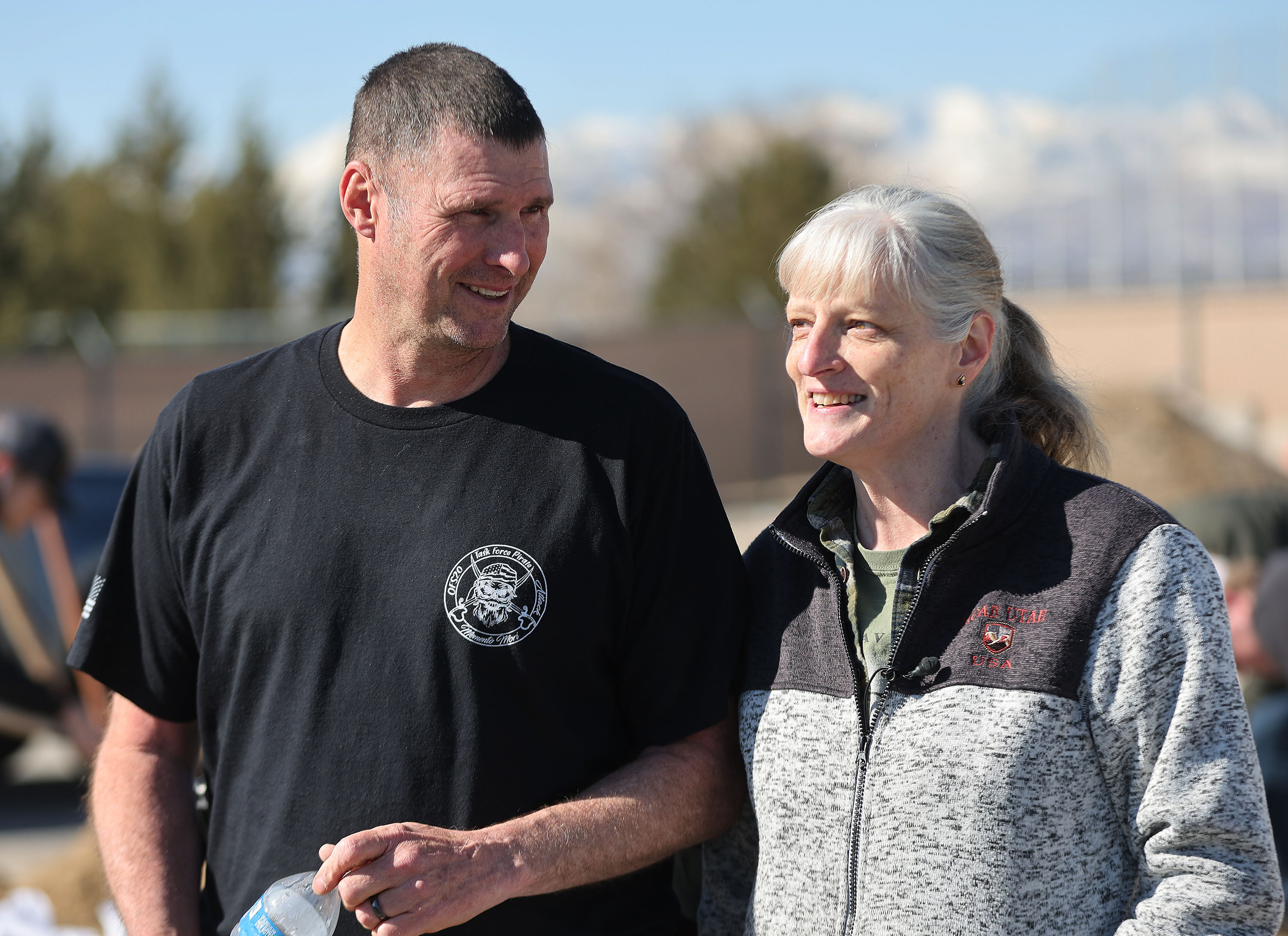 Volunteers Michael and Jayel Kirby talk about assisting in filling sandbags in Midvale on Friday as part of a two-day plan of action preparing for the spring runoff. 