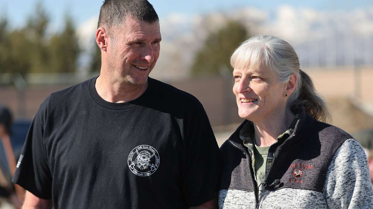 Volunteers Michael and Jayel Kirby talk about assisting in filling sandbags in Midvale on Friday as part of a two-day plan of action preparing for the spring runoff.