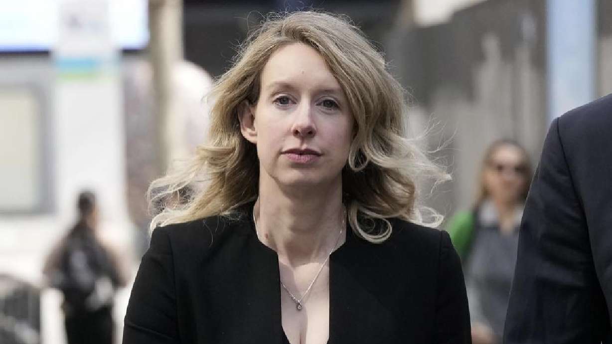 Former Theranos CEO Elizabeth Holmes leaves federal court in San Jose, Calif., Friday. Holmes made a final court appearance attempting a bid to avoid prison.