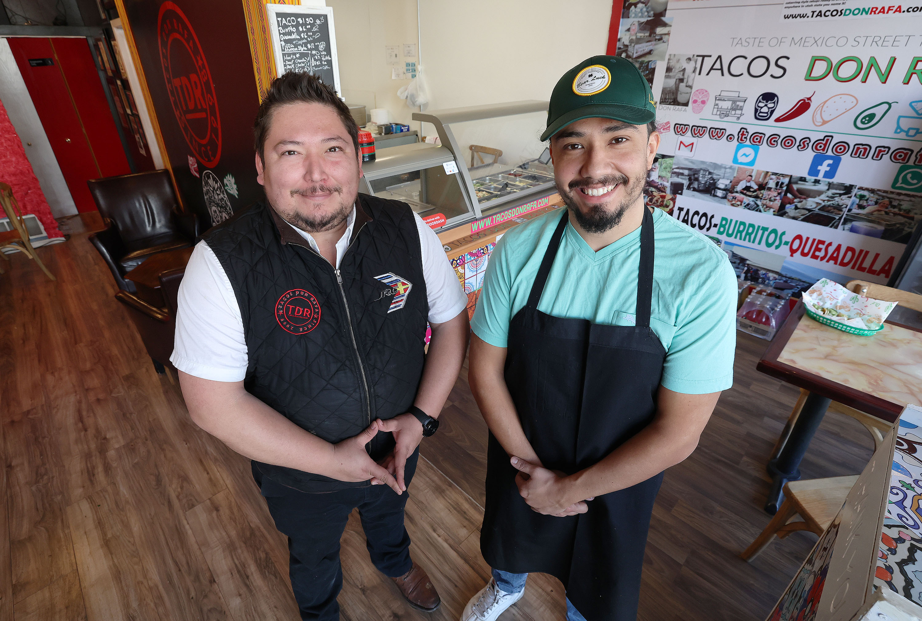 Brothers Cristian and Jessie Rosas pose at Don Rafas tacos in Millcreek on Thursday. Their father, Jesus Rosas, said he is beginning to hand over the reins to his sons.