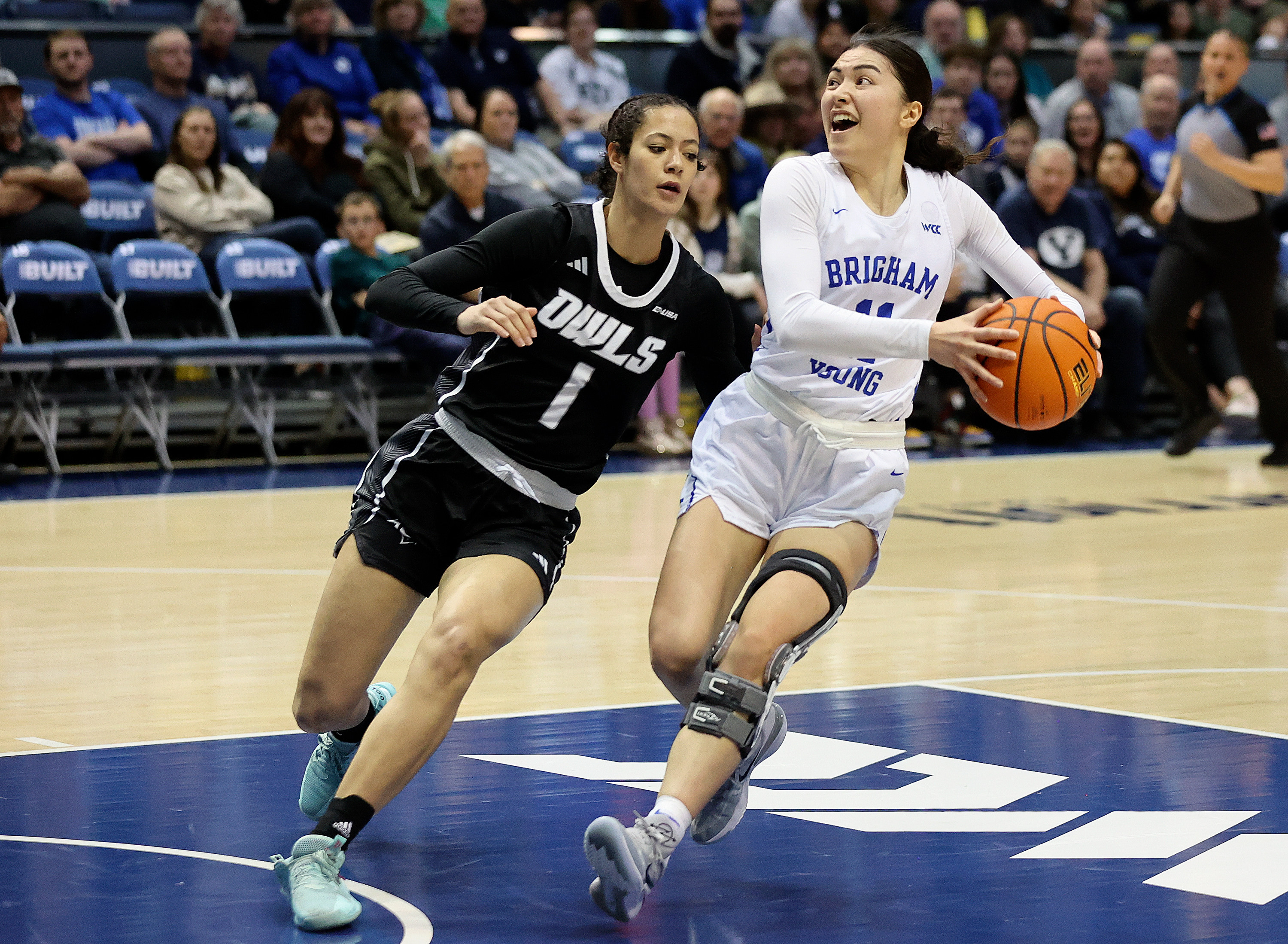 BYU guard Kaylee Smiler (11) moves around Rice Owls forward Malia Fisher (1) during a Women’s National Invitation Tournament basketball game at the Marriott Center in Provo on Friday, March 17, 2023.