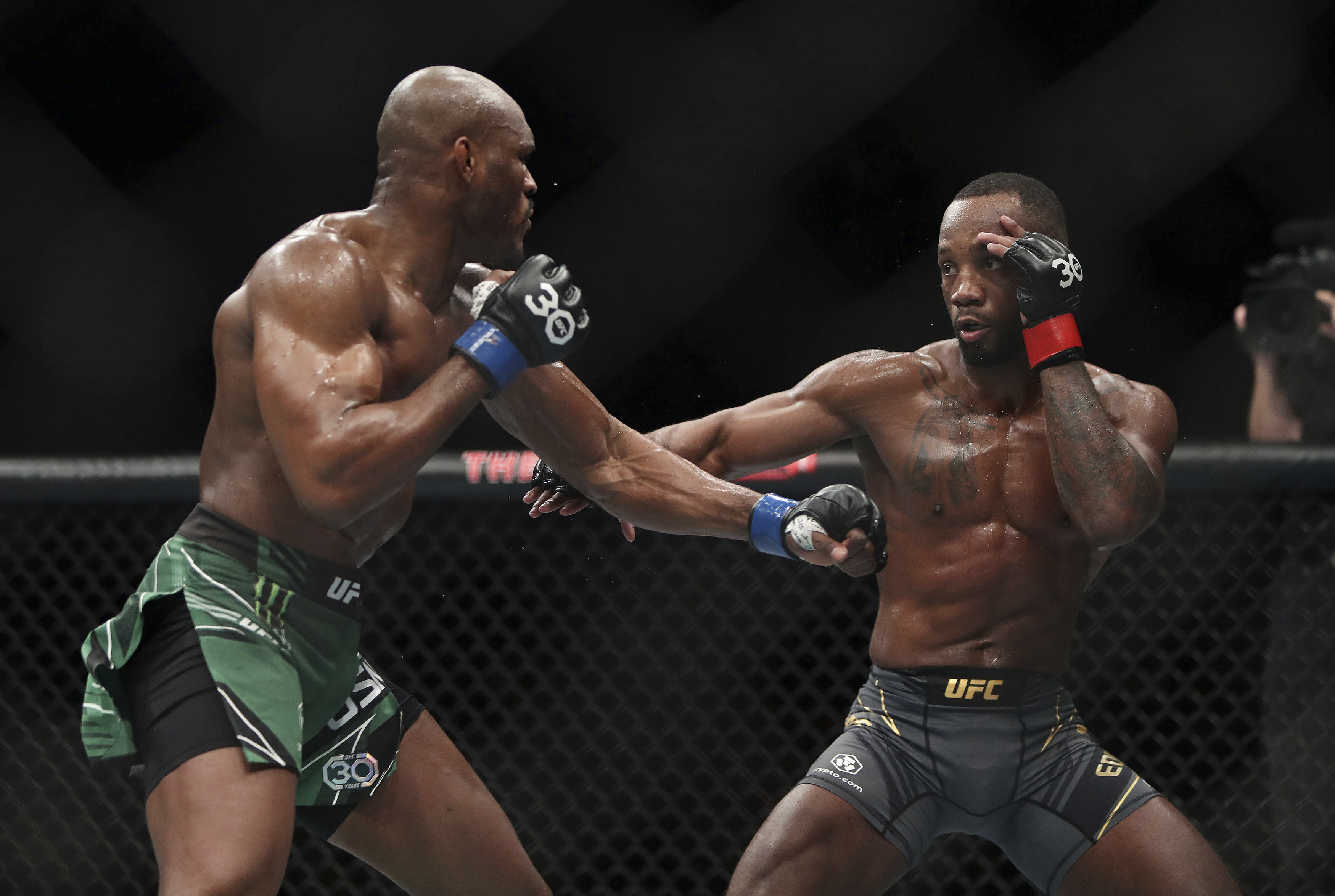 Leon Edwards, right, faces off against Kamaru Usman during their welterweight title bout at the UFC 286 mixed martial arts event Saturday March 18, 2023, in London. 