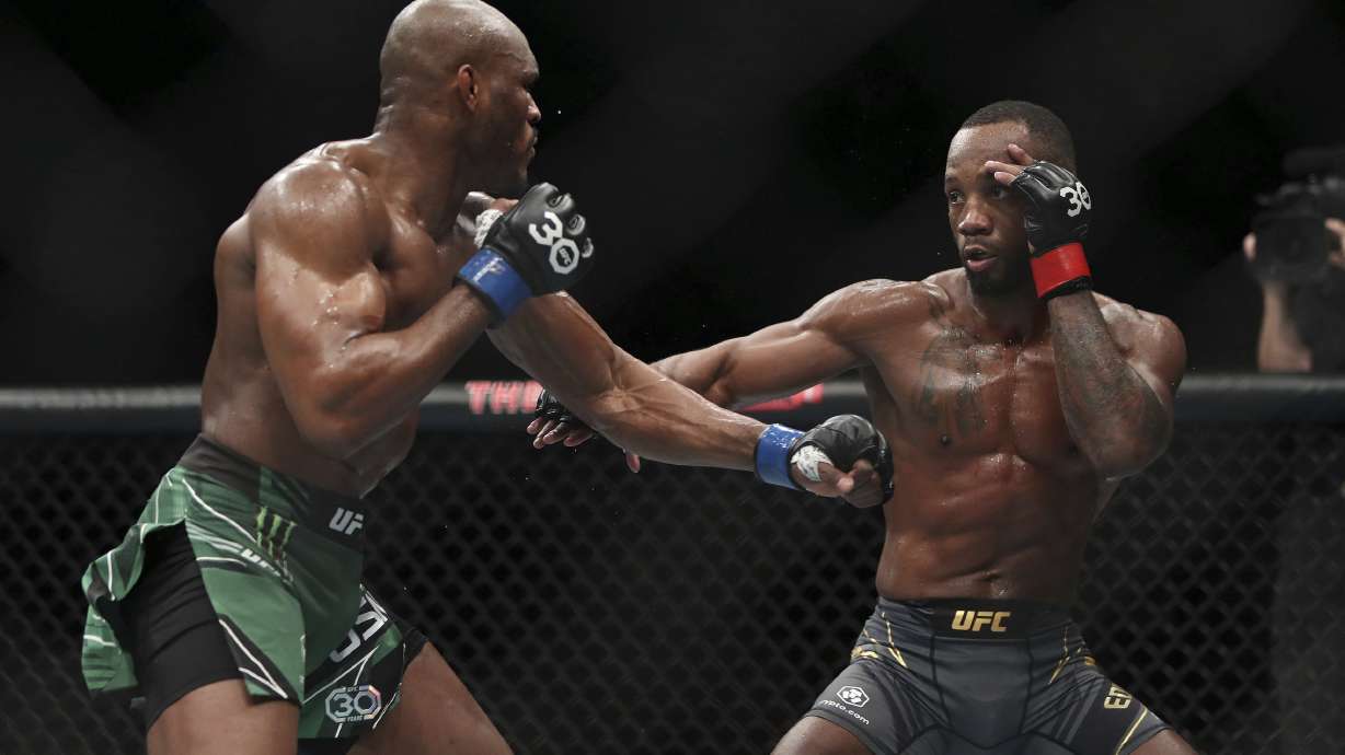 Leon Edwards, right, faces off against Kamaru Usman during their welterweight title bout at the UFC 286 mixed martial arts event Saturday March 18, 2023, in London.