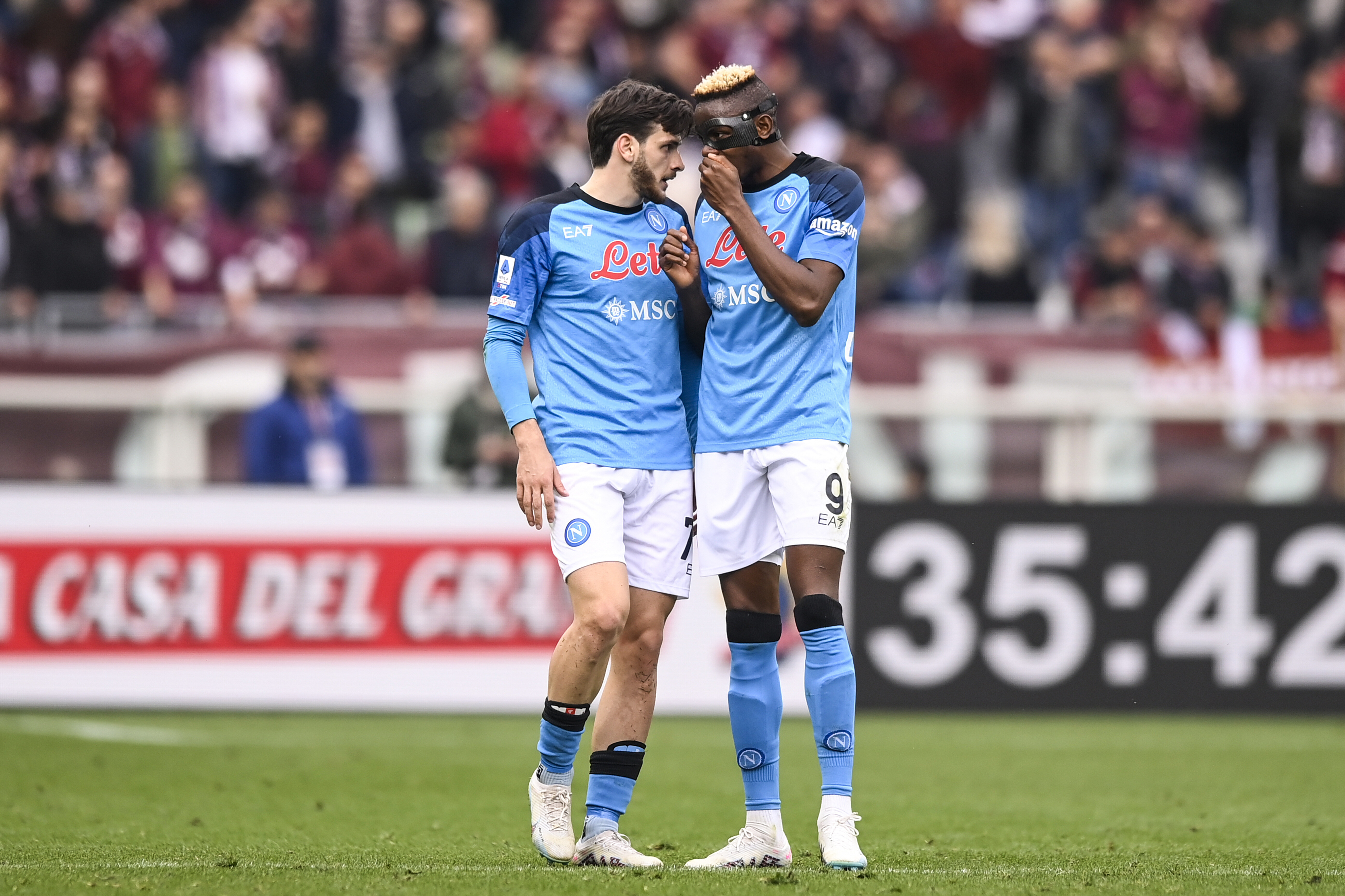 Napoli's Khvicha Kvaratskhelia, left, celebrates with Viktor Osimhen after scoring his side's 2nd goal during the Serie A soccer match between Torino and Napoli at the Turin Olympic stadium, Italy, Sunday, March 19, 2023. 