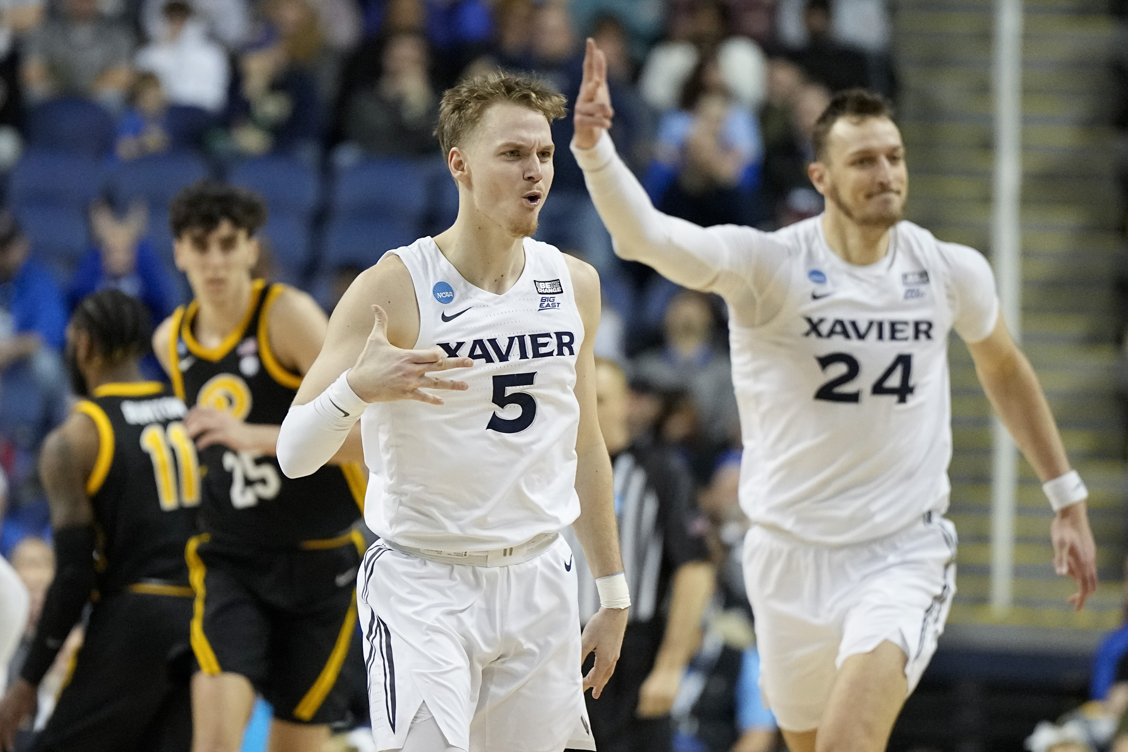 Xavier guard Adam Kunkel celebrates after scoring against Pittsburgh during the first half of a second-round college basketball game in the NCAA Tournament on Sunday, March 19, 2023, in Greensboro, N.C.
