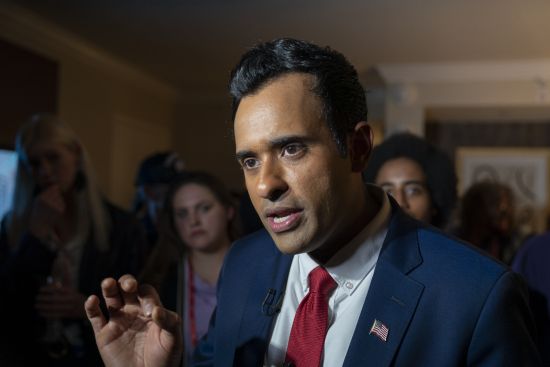 Vivek Ramaswamy speaks with the Associated Press with supporters nearby, at the Conservative Political Action Conference, CPAC 2023, March 3 at National Harbor in Oxon Hill, Md..