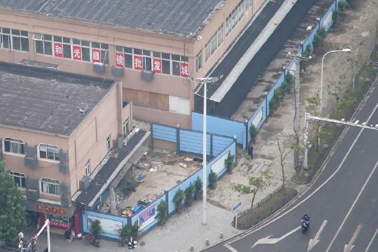 The building of Huanan seafood market, where the second floor remains open for optics stores, and where coronavirus is believed to have first surfaced, almost a year after the start of the coronavirus disease outbreak, in Wuhan, Hubei province, China Dec. 8, 2020.