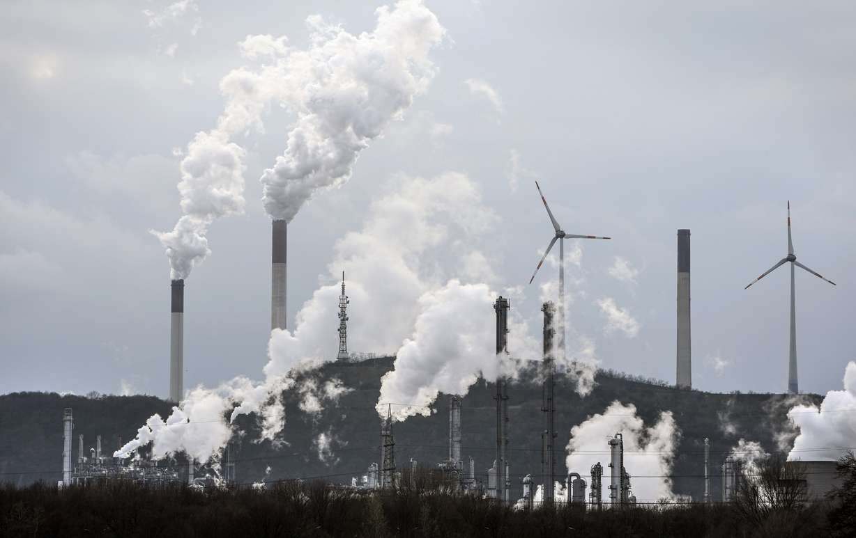 The industrial backdrop of a BP refinery and a Uniper coal-fired power plant is seen in Gelsenkirchen, Germany, March 6. A major new United Nations report released Monday, provides a sobering reminder that time is running out if humanity wants to avoid passing a dangerous global warming threshold.