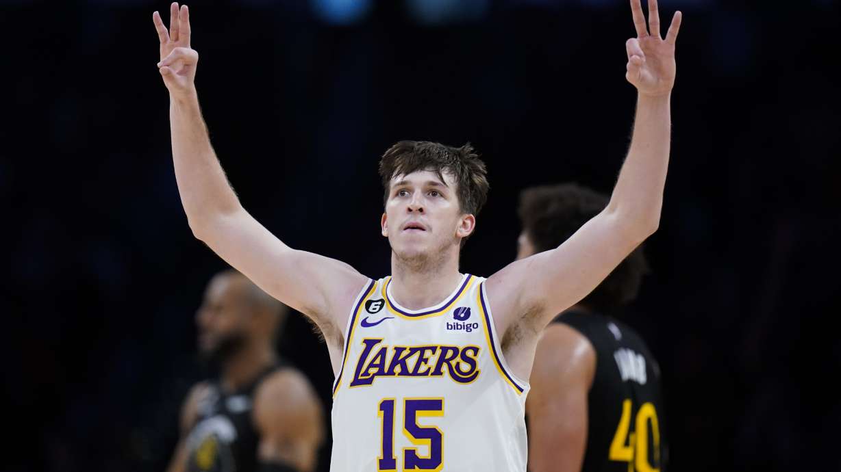 Los Angeles Lakers' Austin Reaves celebrates his three-point basket during the second half of an NBA basketball game against the Golden State Warriors Sunday, March 5, 2023, in Los Angeles.