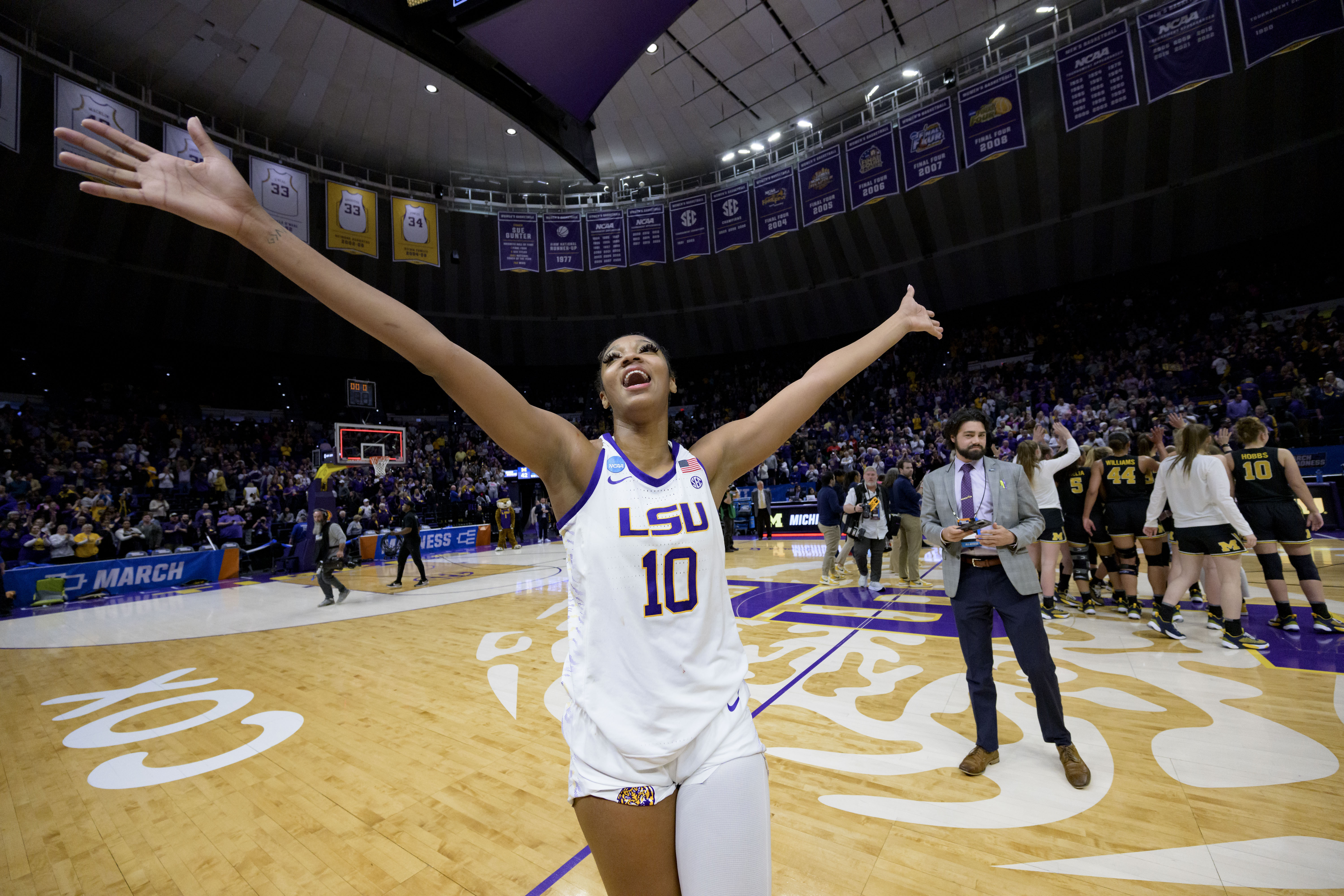 LSU forward Angel Reese (10) waves to the crowd after LSU defeated Michigan in a second-round college basketball game in the women's NCAA Tournament in Baton Rouge, La., Sunday, March 19, 2023.