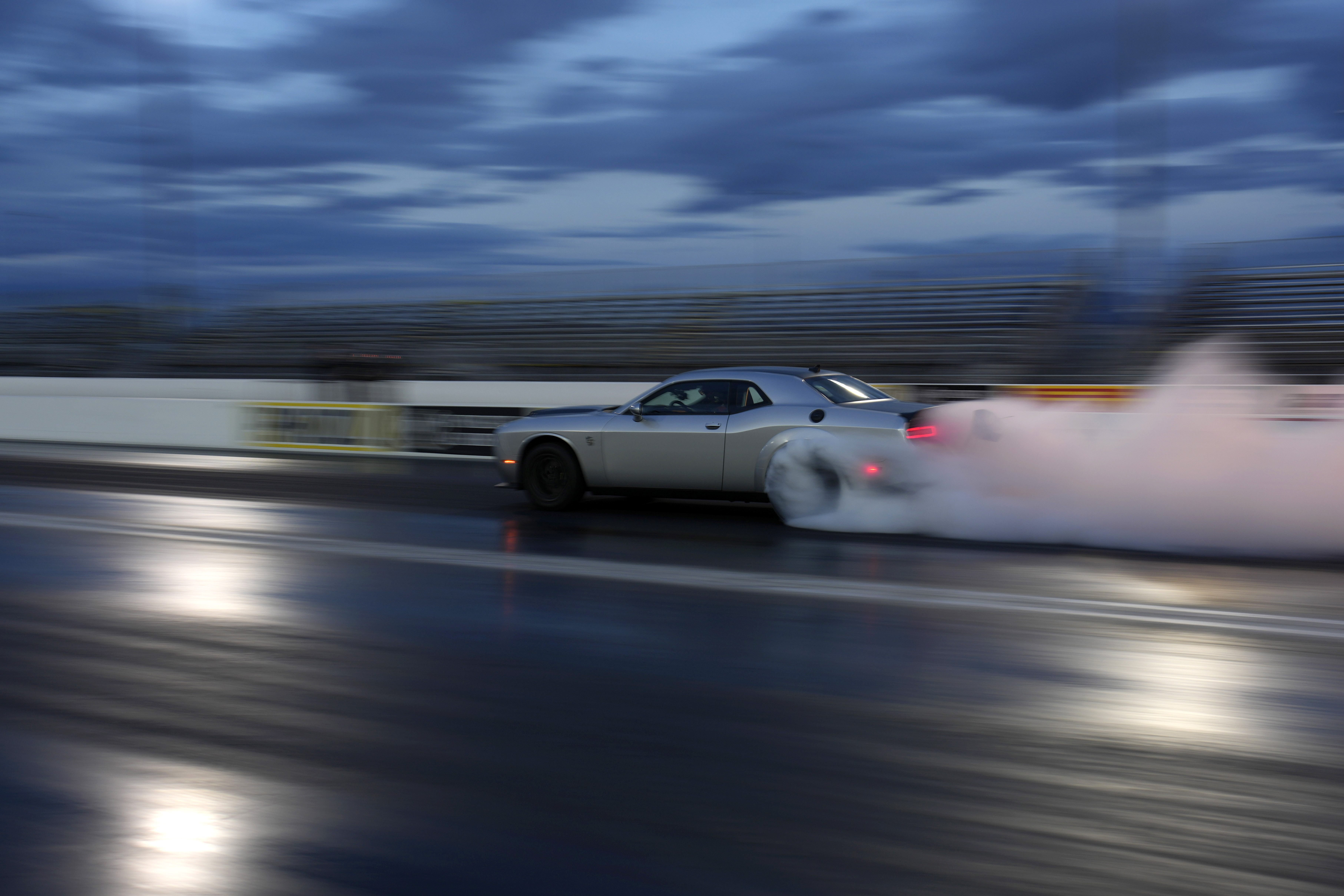 The 2023 Challenger SRT Demon 170 races down a drag strip during an event to unveil the car Monday, in Las Vegas.
