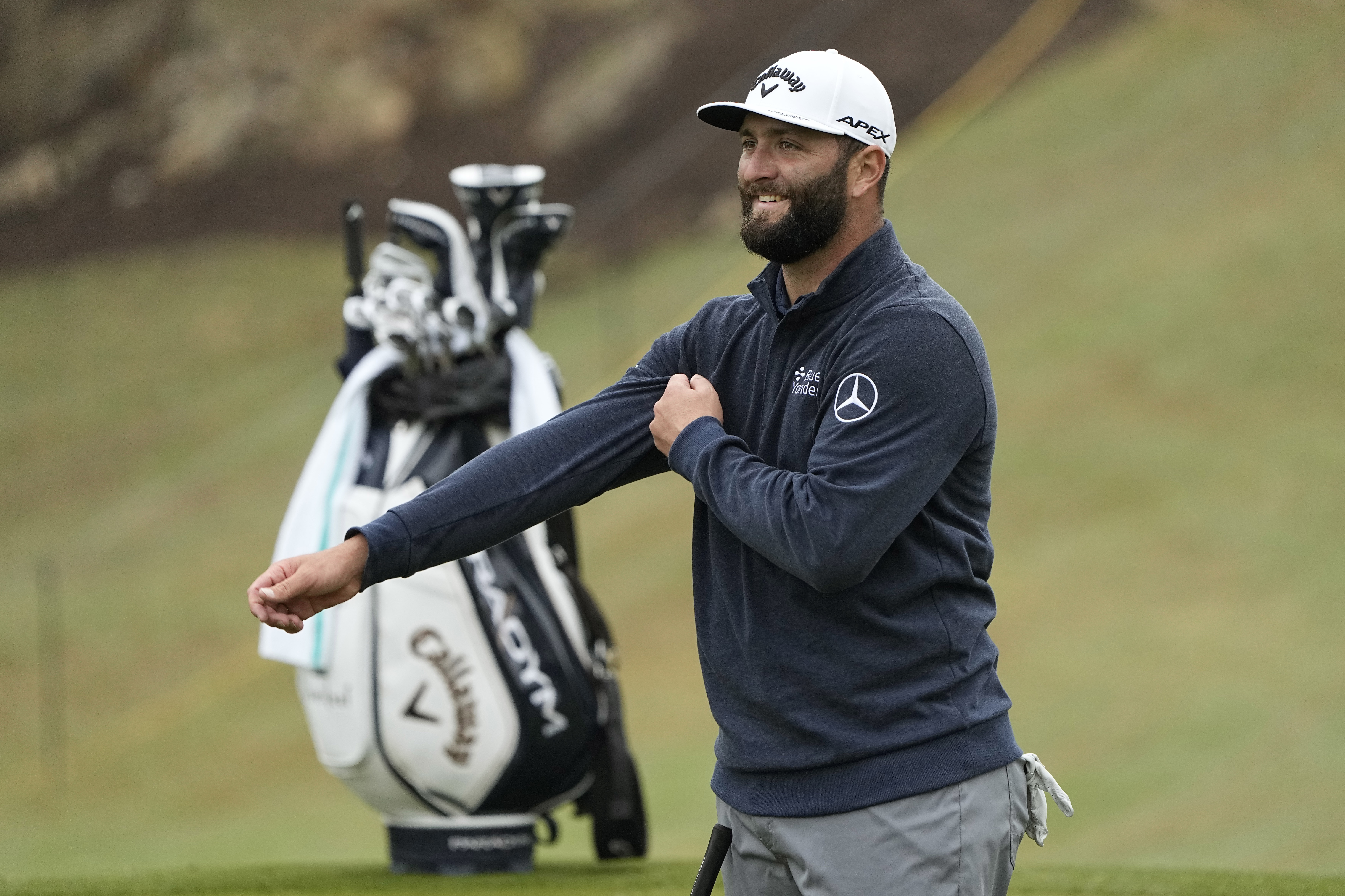 Jon Rahm, of Spain, looks at his shot on the 18th hole during a practice round for the Dell Technologies Match Play Championship golf tournament in Austin, Texas, Tuesday, March 21, 2023.