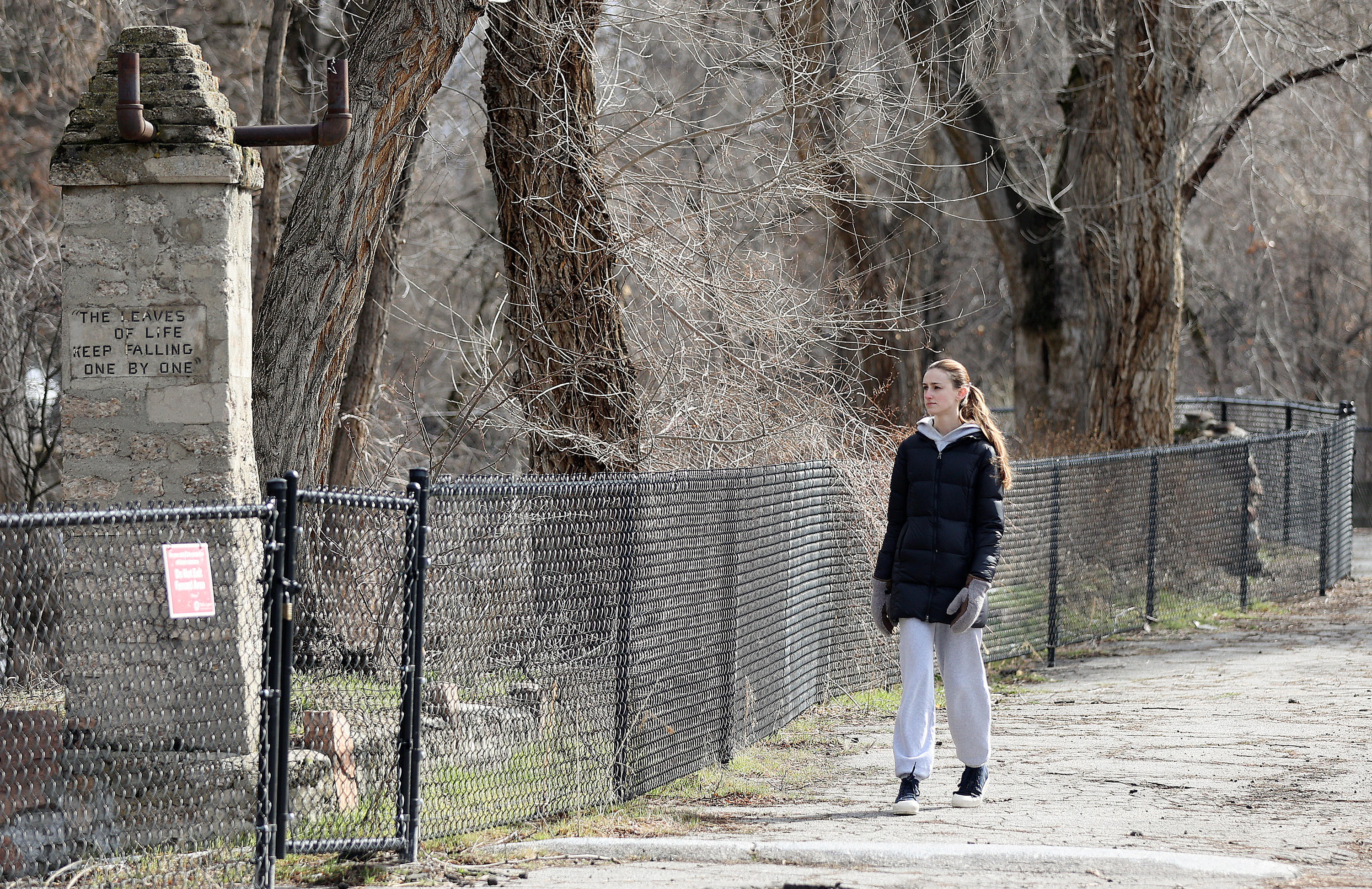 Makaylee Clark walks through Allen Park in Salt Lake City on Tuesday.