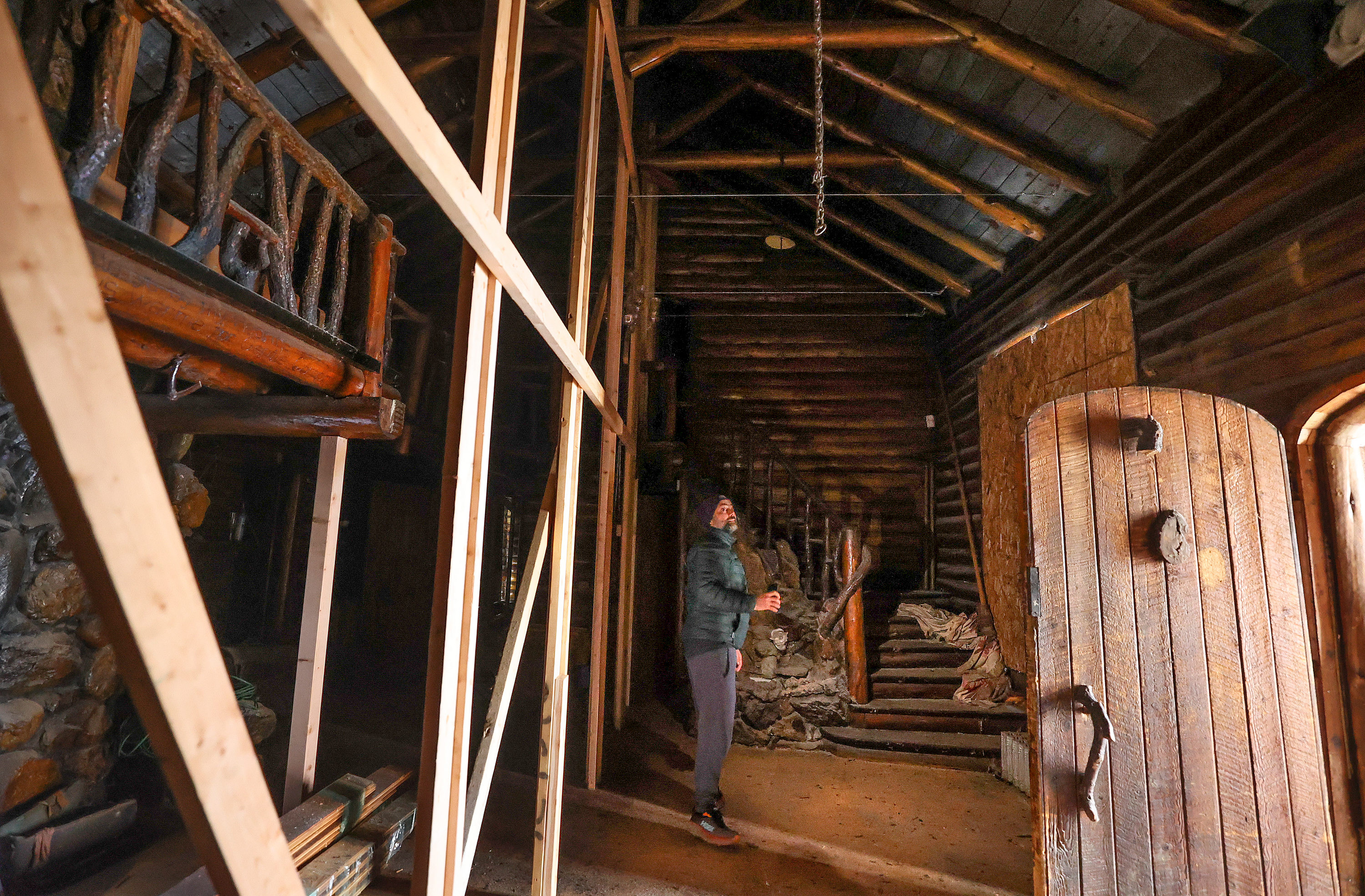 Patrick DePaulis, Friends of Allen Park vice chairman, shows cables and two-by-fours that have been installed to help support the structure of the historic Allen Lodge at Allen Park in Salt Lake City Tuesday. Work is underway to replace the building’s roof.