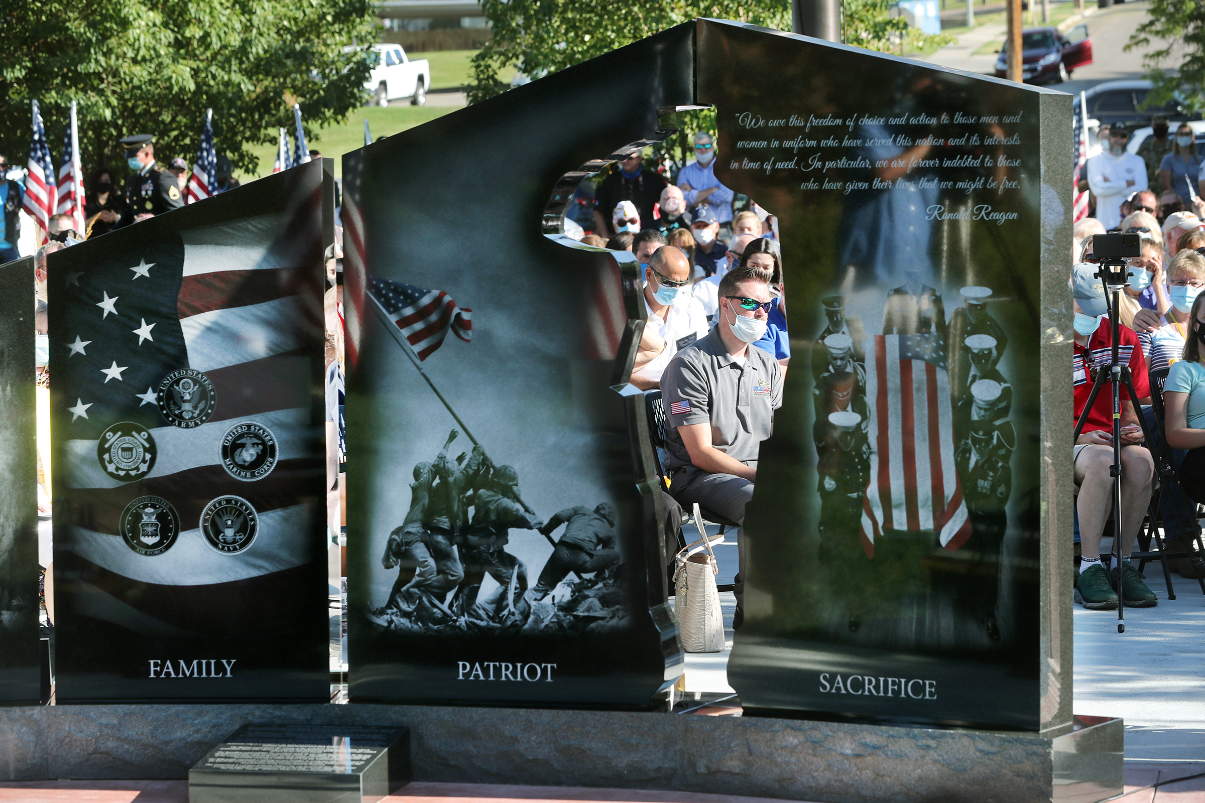 State and local leaders join with families as the Gold Star Families Memorial Monument is unveiled in North Ogden on Aug. 1, 2020. A groundbreaking ceremony was held Tuesday for a Gold Star Families Memorial Monument that will honor the families of servicemen and women who sacrificed their lives while serving in the military.