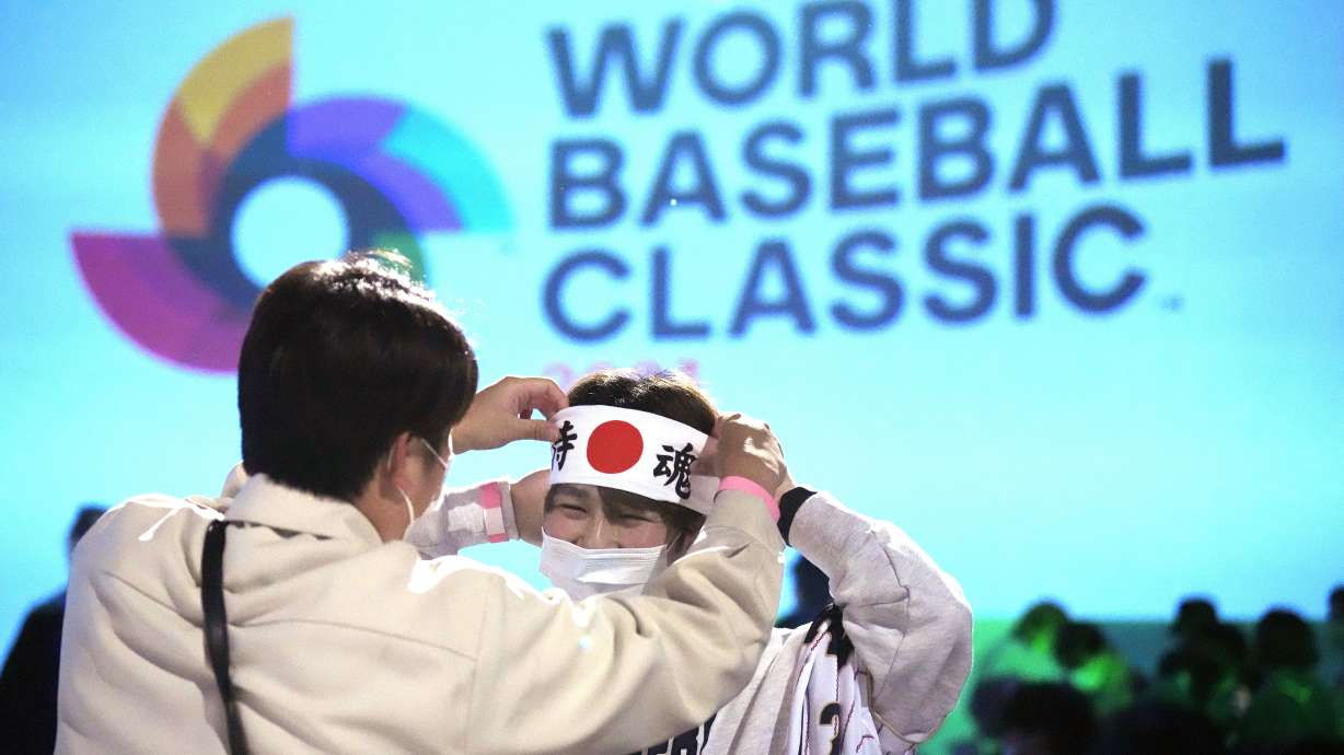 One of Japan fan prepares to cheer their them before they watch on a live stream of a World Baseball Classic (WBC) final between Japan and United States being played at LoanDepot Park in Miami, during a public viewing event Wednesday, March 22, 2023, in Tokyo.