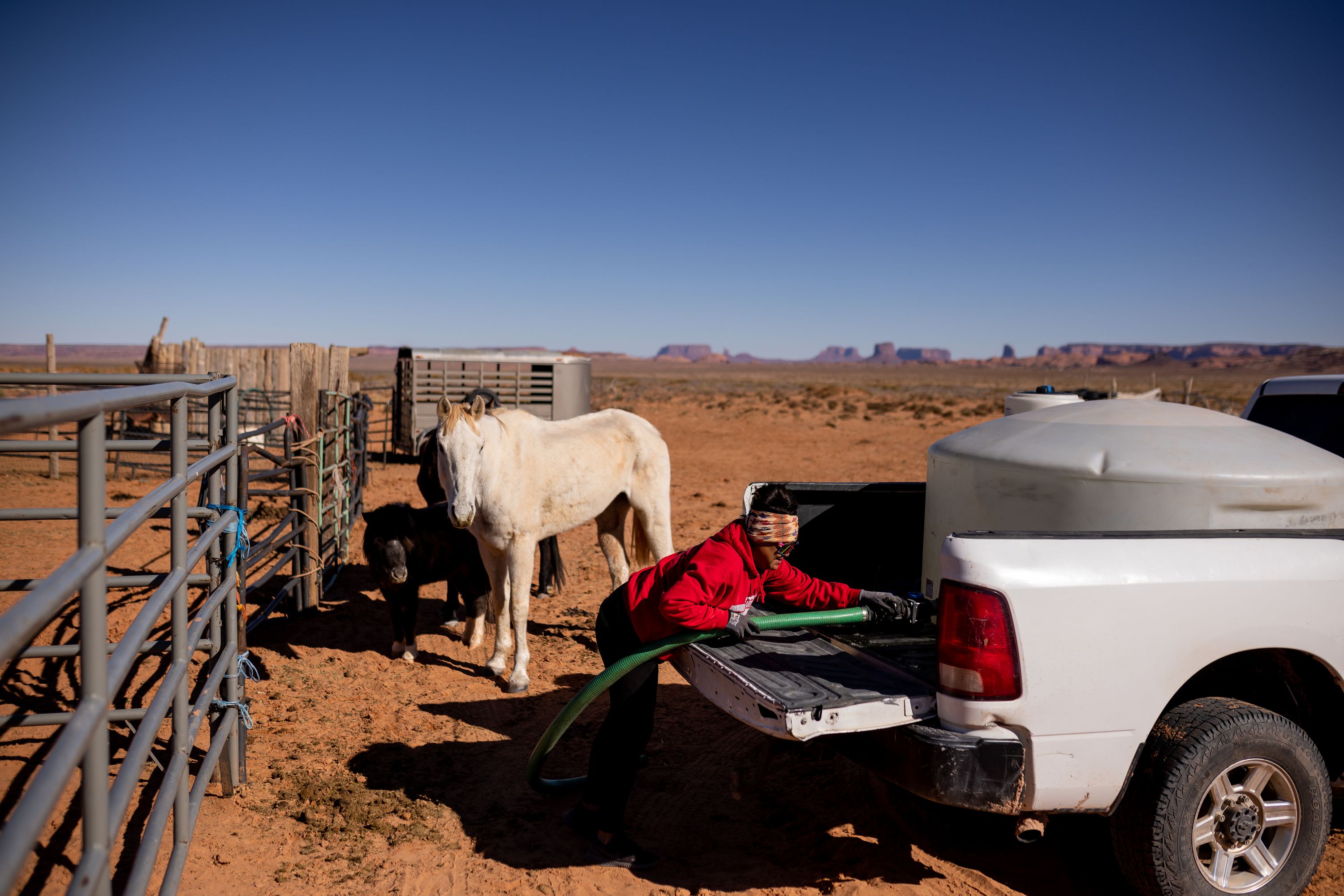 Melcita Stanley hauls water for her livestock to her property in the Narrow Canyon area of the Navajo Nation in Arizona on Nov. 16, 2022. The Supreme Court is currently hearing arguments concerning water rights on the Navajo Nation.