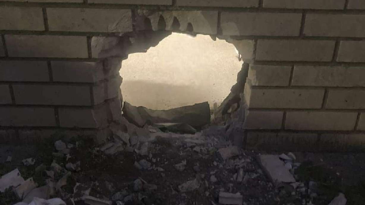 A hole in the wall of a prison cell in Newport News, Va. is shown on Monday. Two inmates used primitive-made tools to escape their cell, only to be found hours later at an IHOP restaurant.