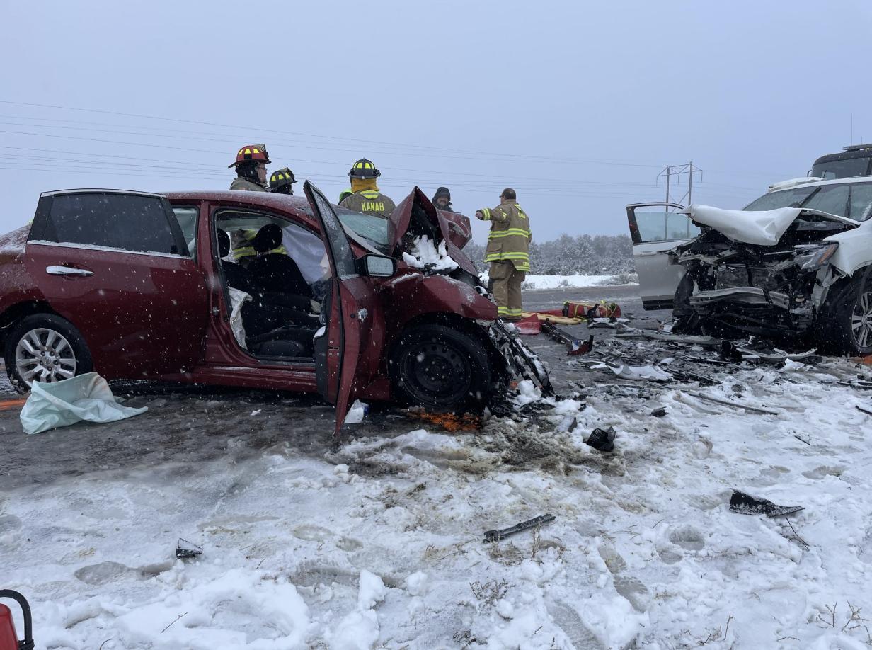 First responders survey the scene of a crash that killed three people in southern Utah on Tuesday
