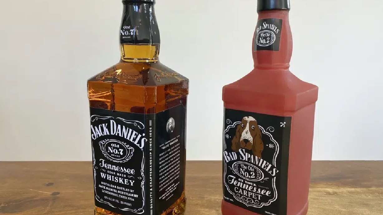 A bottle of Jack Daniel's Tennessee Whiskey is displayed next to a Bad Spaniels dog toy in Arlington, Virginia, Nov. 20, 2022. The Supreme Court is hearing a dispute between Jack Daniel’s and the manufacturer of the squeaking dog toy.