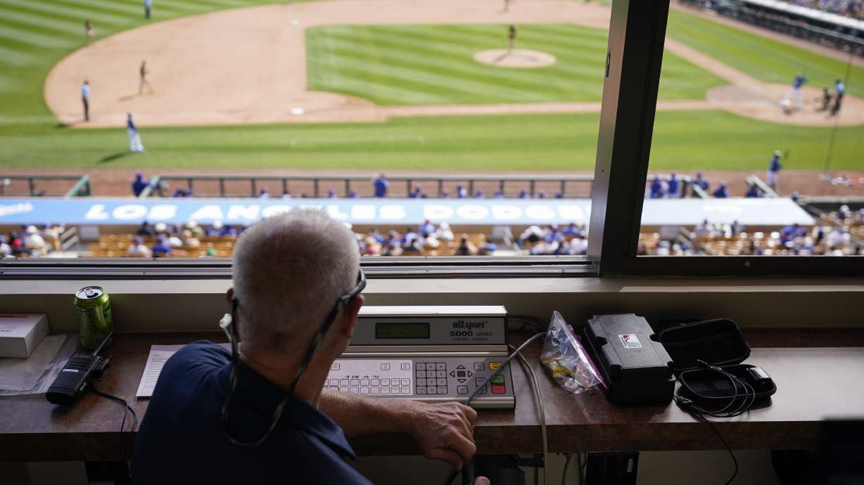 The pitch clock is operated in the press box during the sixth inning of a spring training baseball game between the San Diego Padres and the Los Angeles Dodgers in Glendale, Calif., Monday, March 6, 2023.
