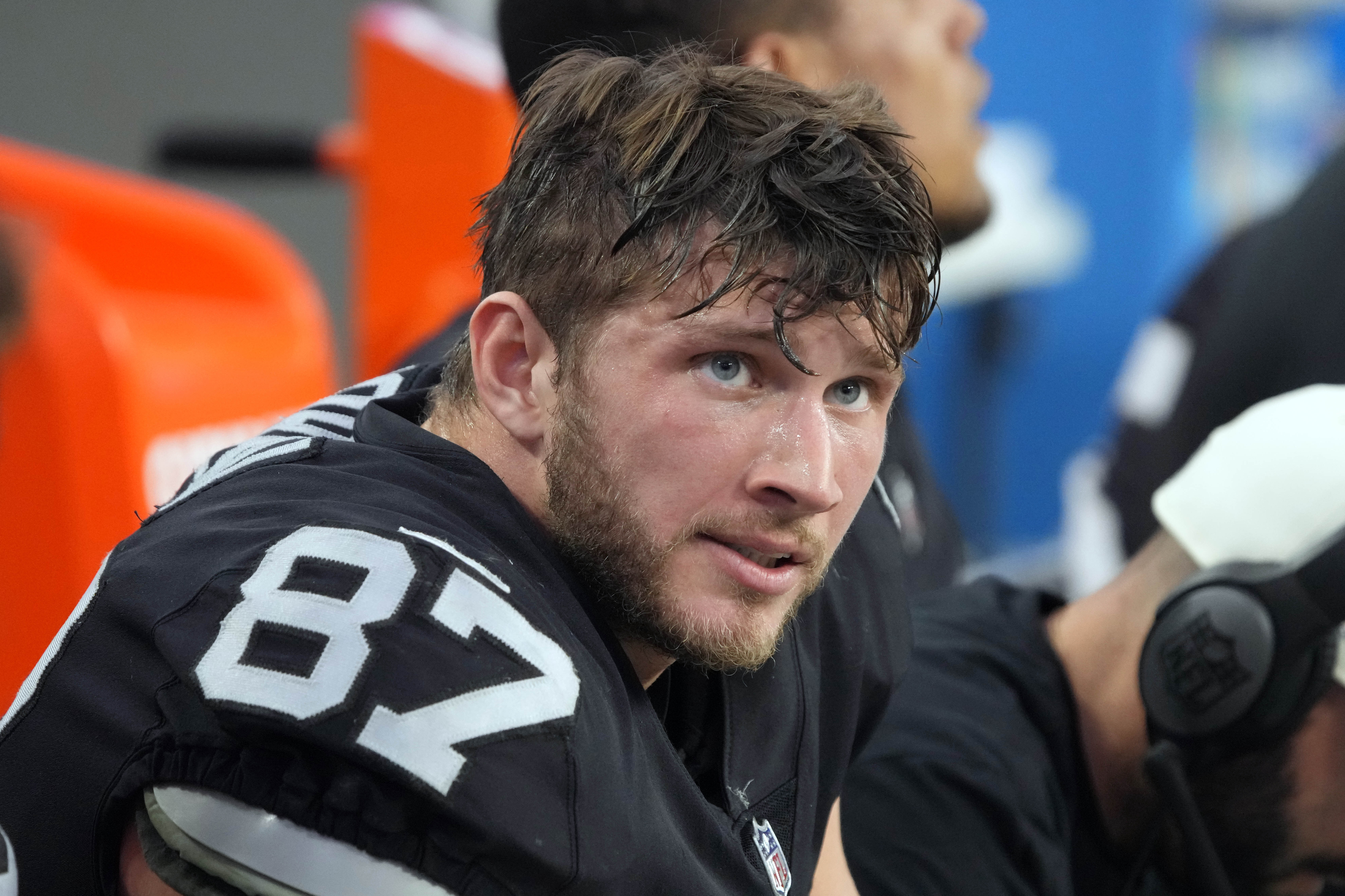 FILE -Las Vegas Raiders tight end Foster Moreau (87) watches from the sideline during the first half of an NFL football game against the Kansas City Chiefs, Saturday, Jan. 7, 2023, in Las Vegas. NFL free-agent tight end Foster Moreau was diagnosed with Hodgkin’s lymphoma during a physical with the New Orleans Saints, he posted Wednesday, March 22, 2023 on Twitter.