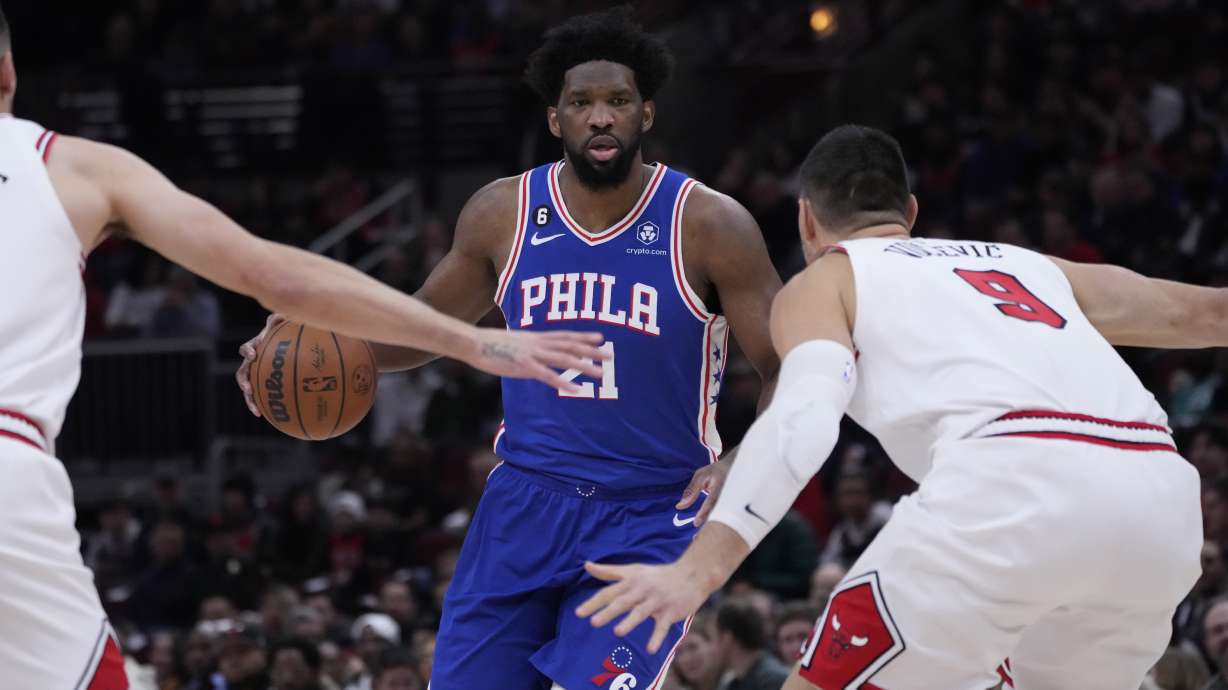 Philadelphia 76ers' Joel Embiid brings the ball up during the first half of an NBA basketball game against the Chicago BullsWednesday, March 22, 2023, in Chicago.