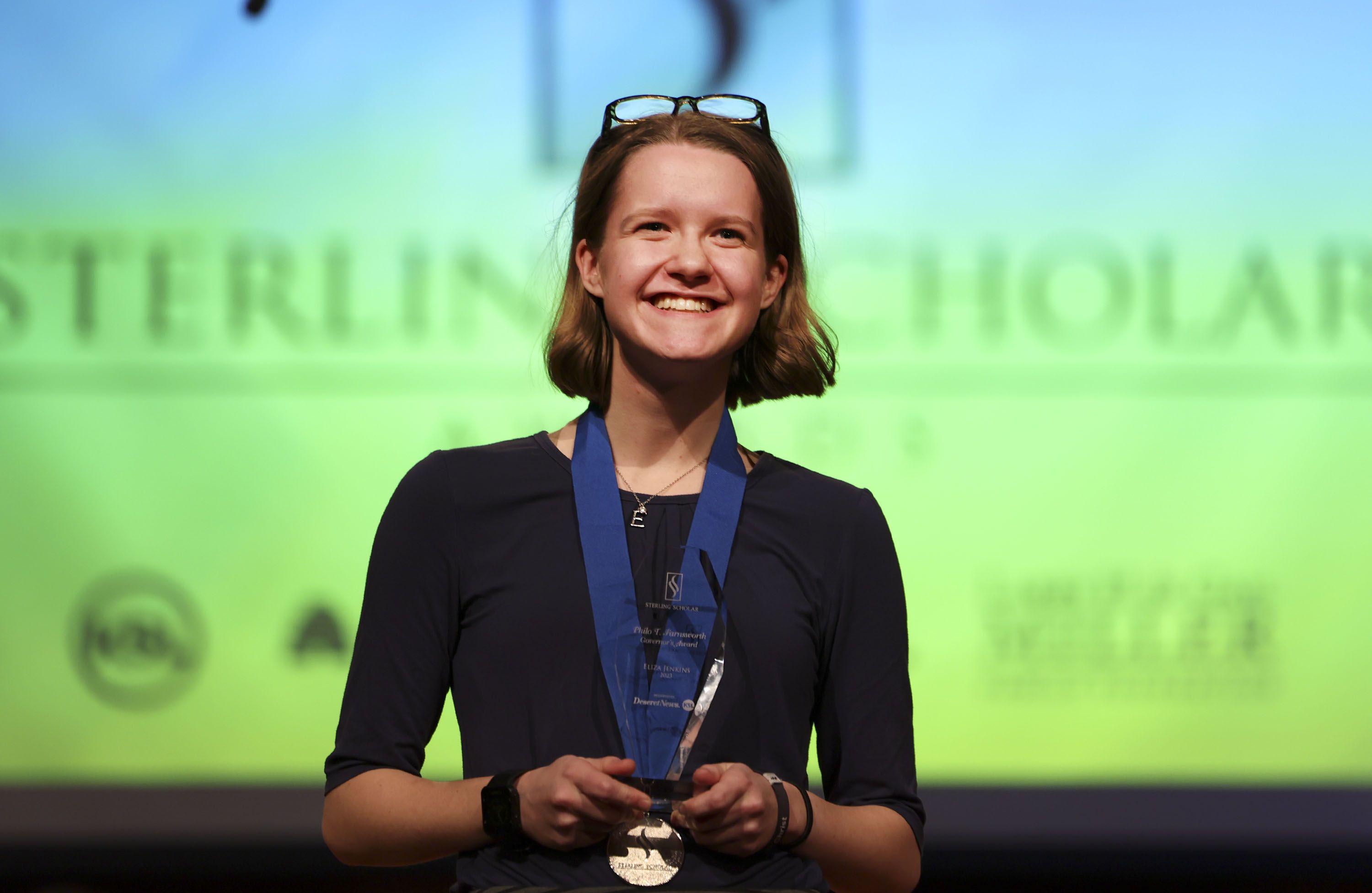 Timpview High School’s Eliza Jenkins accepts the Philo T. Farnsworth Governor’s Award during the 2023 Sterling Scholar awards ceremony in North Salt Lake on Wednesday.