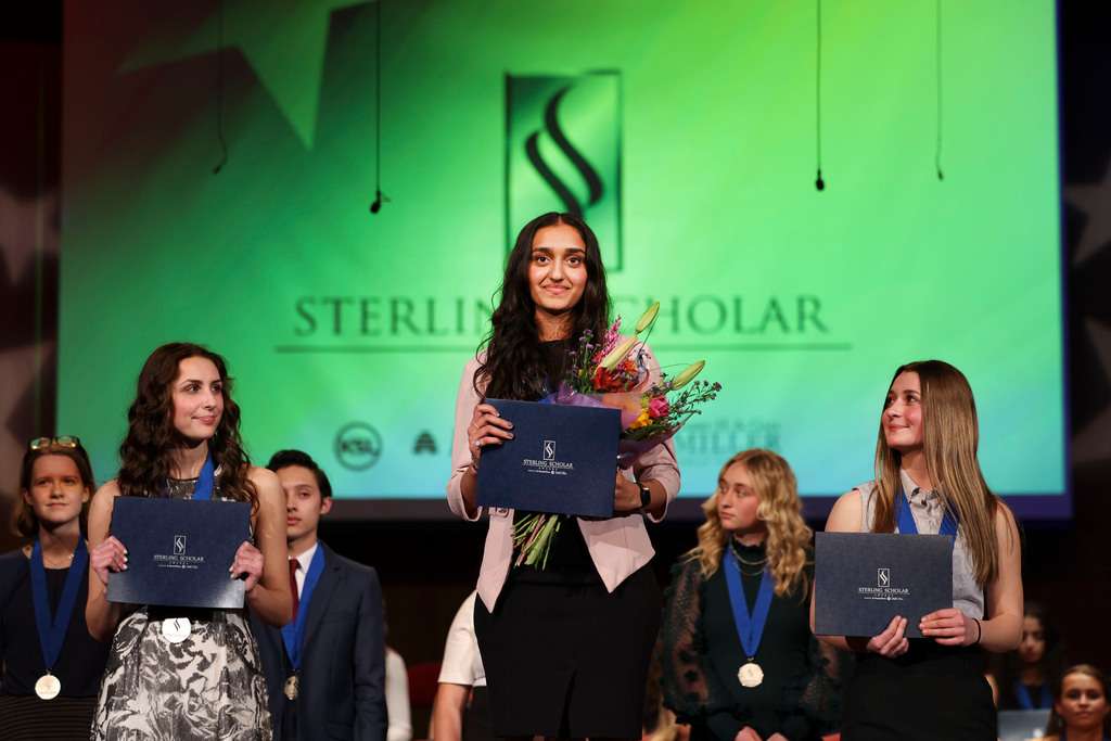 West High School’s Divya Sundar, center, is awarded with the Skilled & Technical Sciences Education award during the 2023 Sterling Scholar awards ceremony in North Salt Lake on Wednesday. Melia Funes of Timpanogos High, left, and Reagan Manwaring of Brighton High, right, were awarded as runner-up.