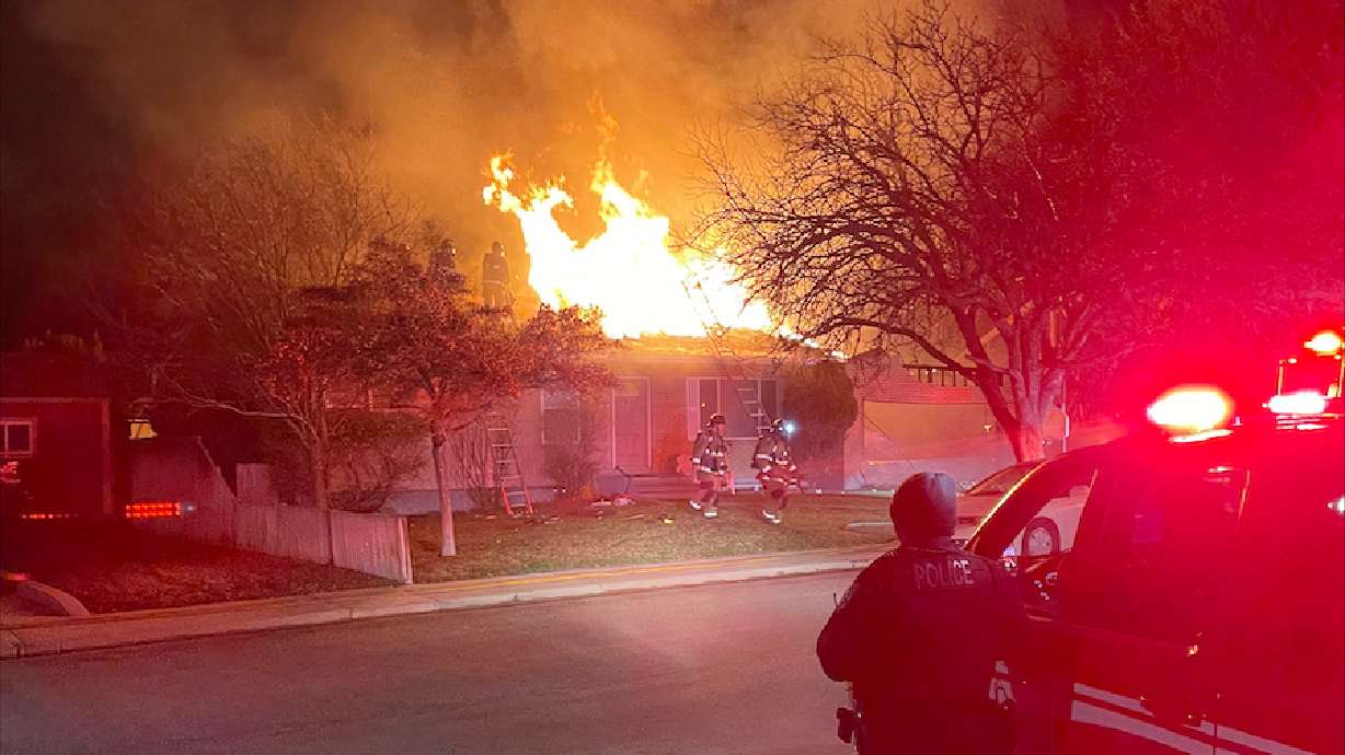 Crews work to put out a fire at a home in Orem on March 22. A Holladay man has been charged with setting an Orem house on fire.