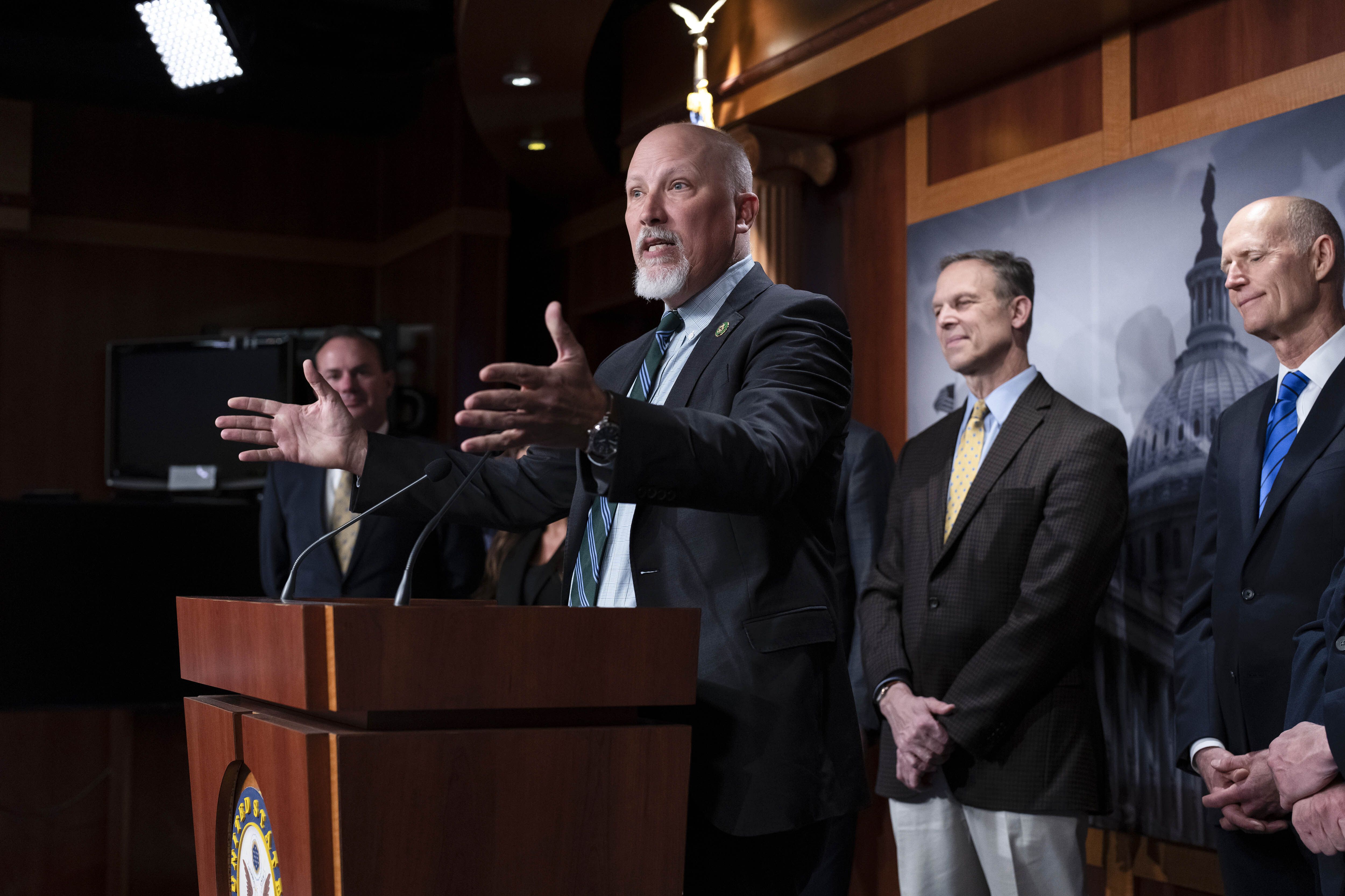 Rep. Chip Roy, R-Texas, joined by, from left, Sen. Mike Lee, R-Utah, Rep. Scott Perry, R-Pa., and Sen. Rick Scott, R-Fla., speaks as the conservative House Freedom Caucus and Republican senators hold a news conference on the debt limit at the Capitol in Washington, Wednesday.