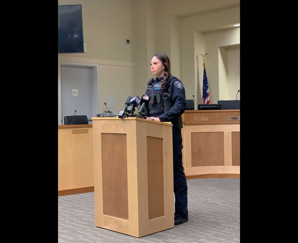 Woods Cross police officer BreeAnna Hill speaks with members of the news media on Thursday, March 23, 2023, about a gym owner charged with multiple counts of voyeurism and sexually exploiting minors. Police say 33-year-old Adam Richard Jacobs, owner of USA Gymnastics World, hid a camera in the facility's bathroom and recorded videos of children changing clothes or using the toilet.