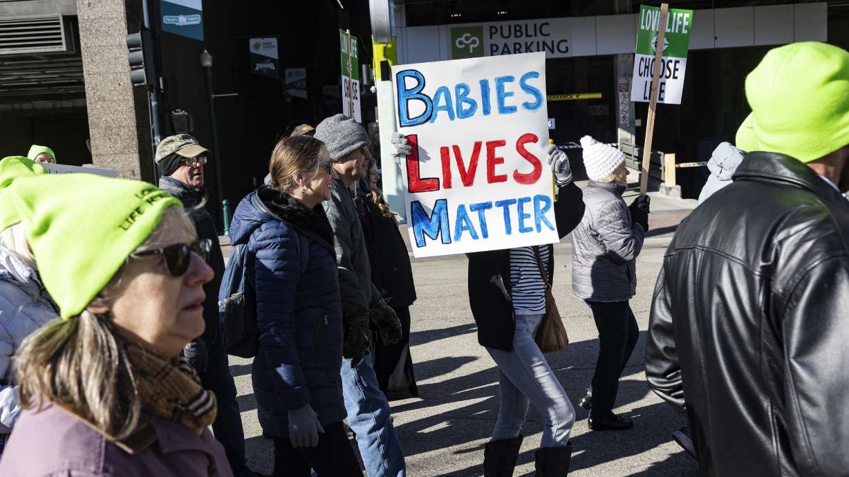 People walk to the Idaho Capitol Building for the Boise March for Life rally, Jan. 21. A rural hospital in Sandpoint, Idaho, will stop delivering babies, citing recently passed state laws criminalizing medical care, among other reasons.
