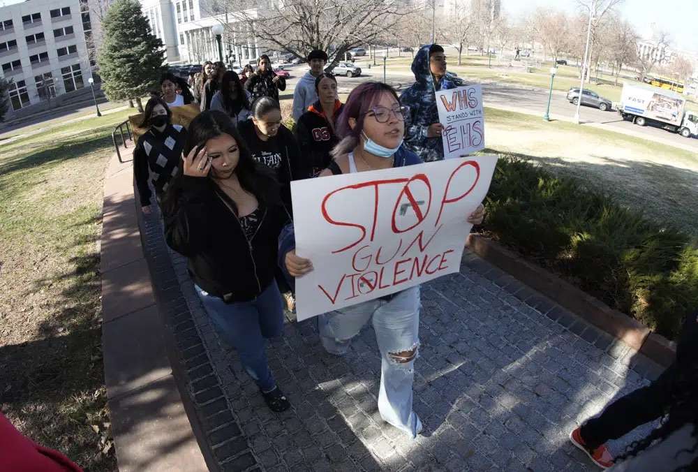 Students from Denver's West High School join forces with East High School students to call for gun control measures to be considered by state lawmakers Thursday during a rally outside the State Capitol in Denver. A shooting left two administrators injured at East High School on Wednesday, one of a series of gun-related events at the school in the past six weeks.