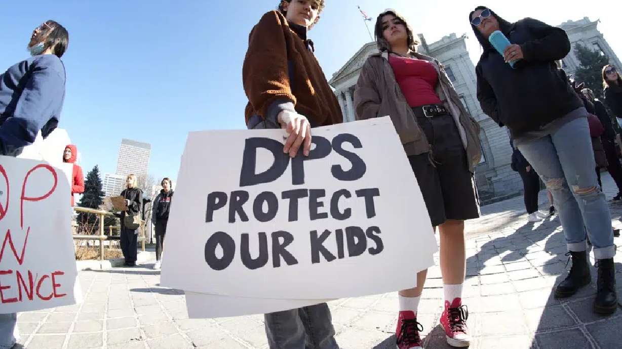 Students from Denver's East High School and West High School join forces to call for gun control measures to be considered by state lawmakers Thursday during a rally outside the State Capitol in Denver.