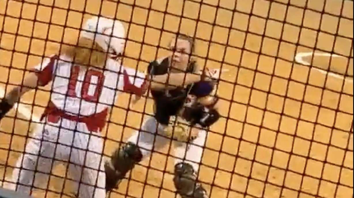 A softball players busted out the old "look over there" move to score.