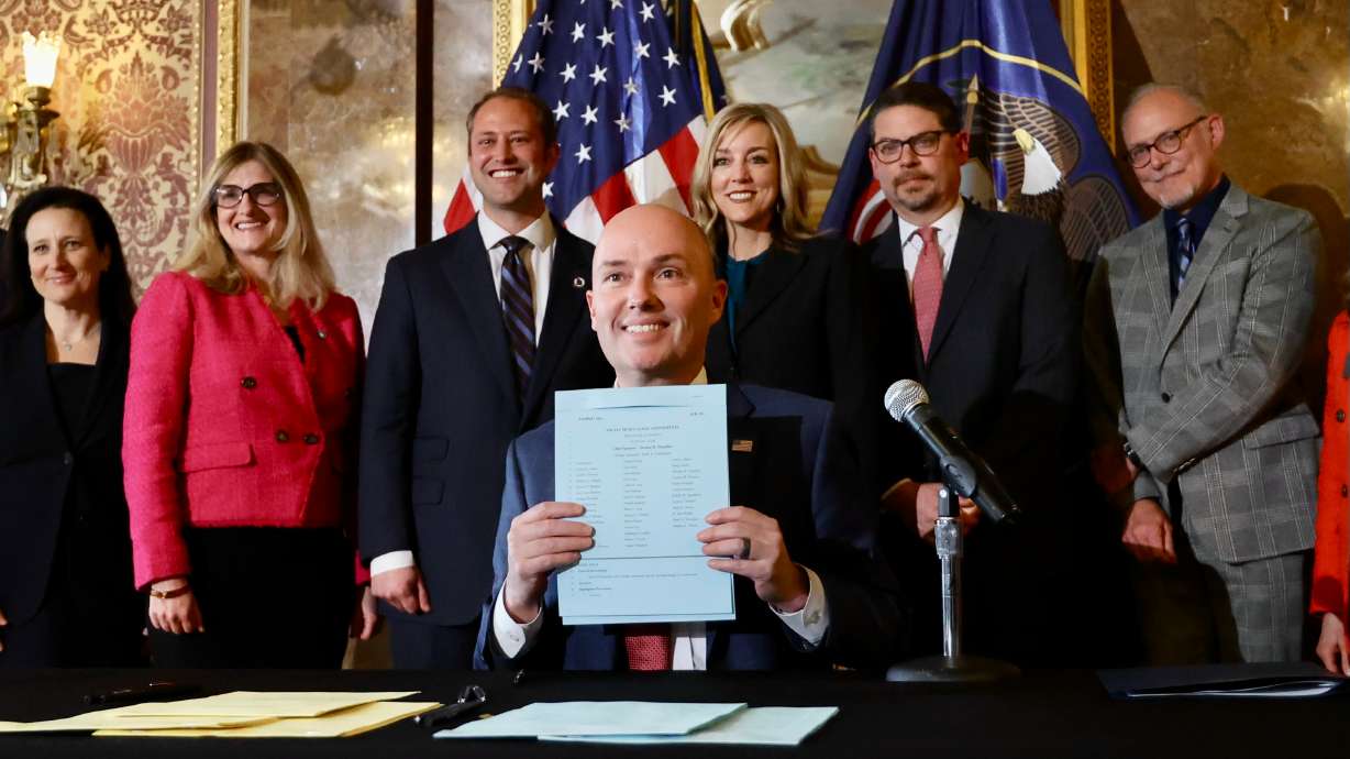 Gov. Spencer Cox poses for a photo after signing HB311 Social Media Usage Amendments at the Capitol in Salt Lake City on Thursday. The action marks the nation's first major social media regulations becoming law.