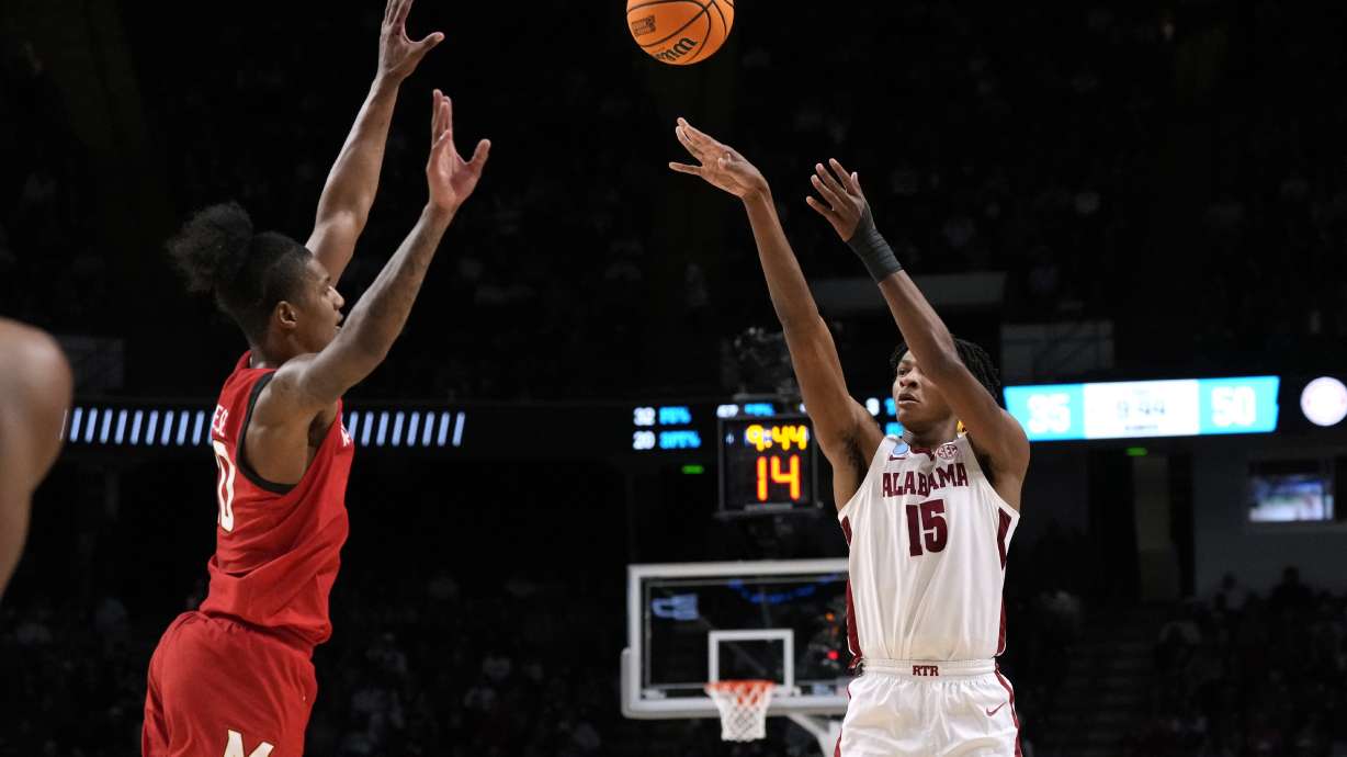 Alabama forward Noah Clowney (15) shoots past Maryland forward Julian Reese during the second half of a second-round college basketball game in the men's NCAA Tournament in Birmingham, Ala., Saturday, March 18, 2023. Alabama won 73-51.